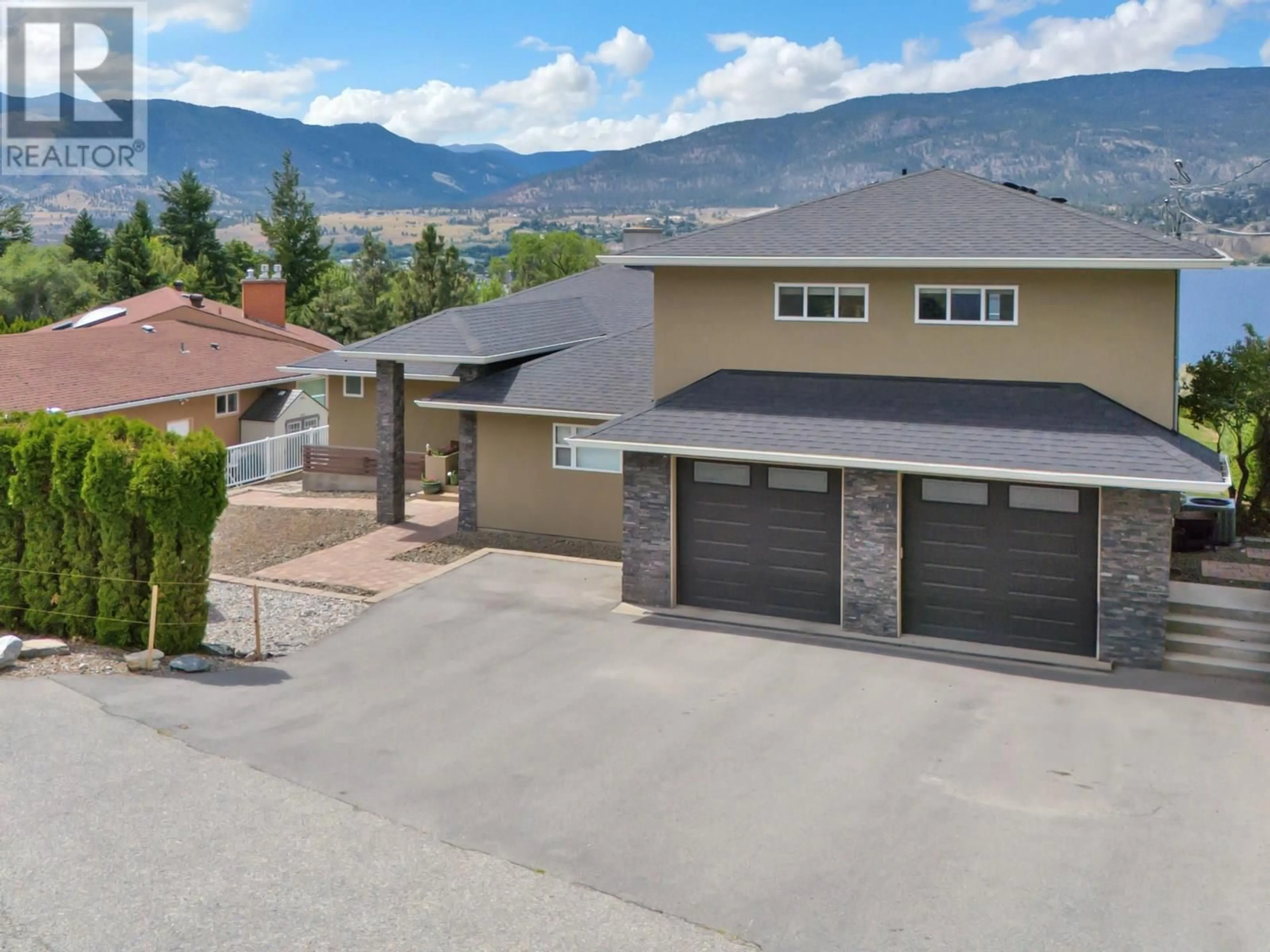 A pic from outside/outdoor area/front of a property/back of a property/a pic from drone, mountain view for 157 BANKVIEW ROAD, Penticton British Columbia V2A1B3