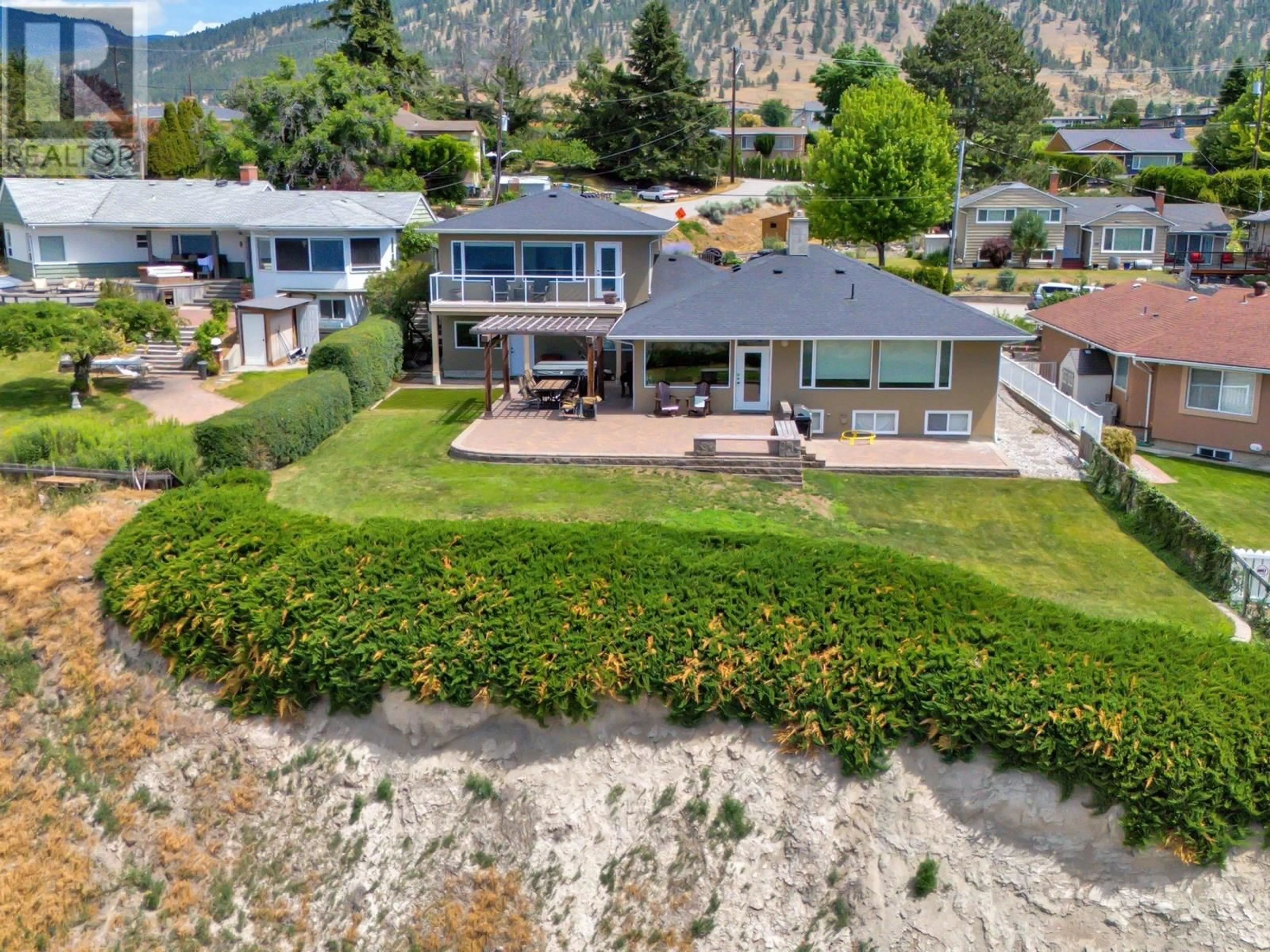 A pic from outside/outdoor area/front of a property/back of a property/a pic from drone, mountain view for 157 BANKVIEW ROAD, Penticton British Columbia V2A1B3