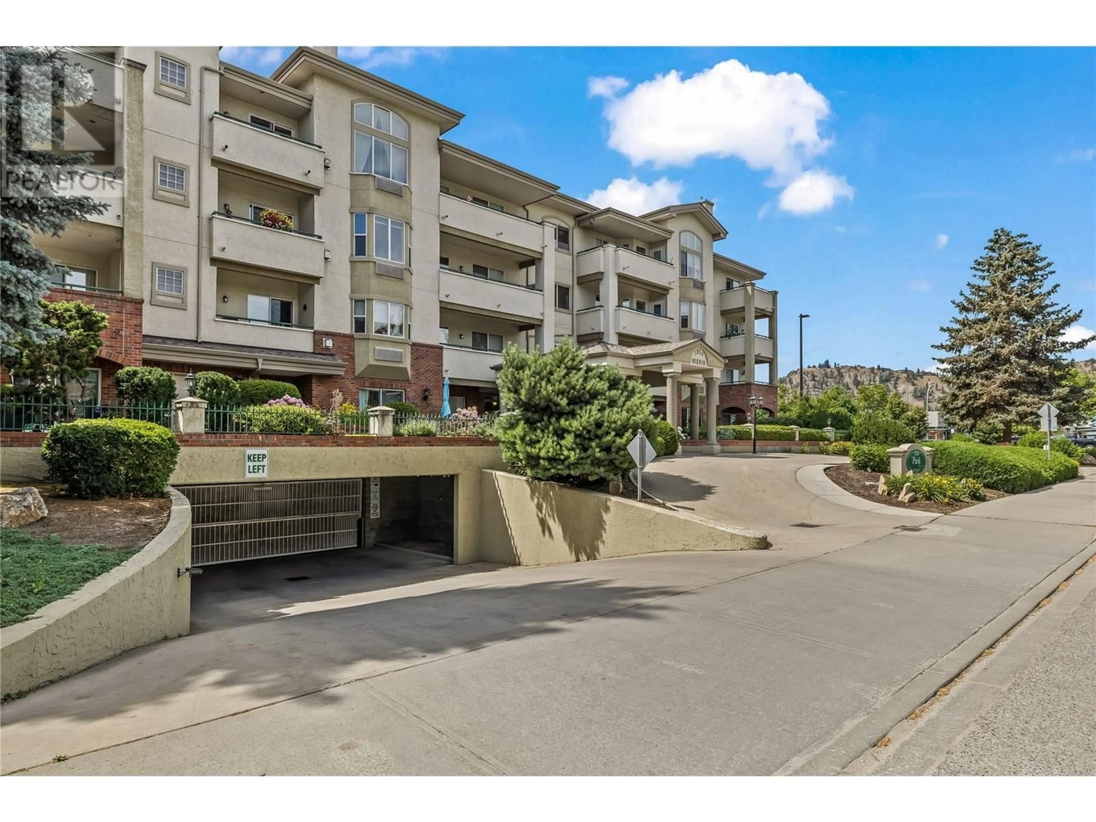 A pic from outside/outdoor area/front of a property/back of a property/a pic from drone, street for 402 - 1950 DURNIN ROAD, Kelowna British Columbia V1X7W6