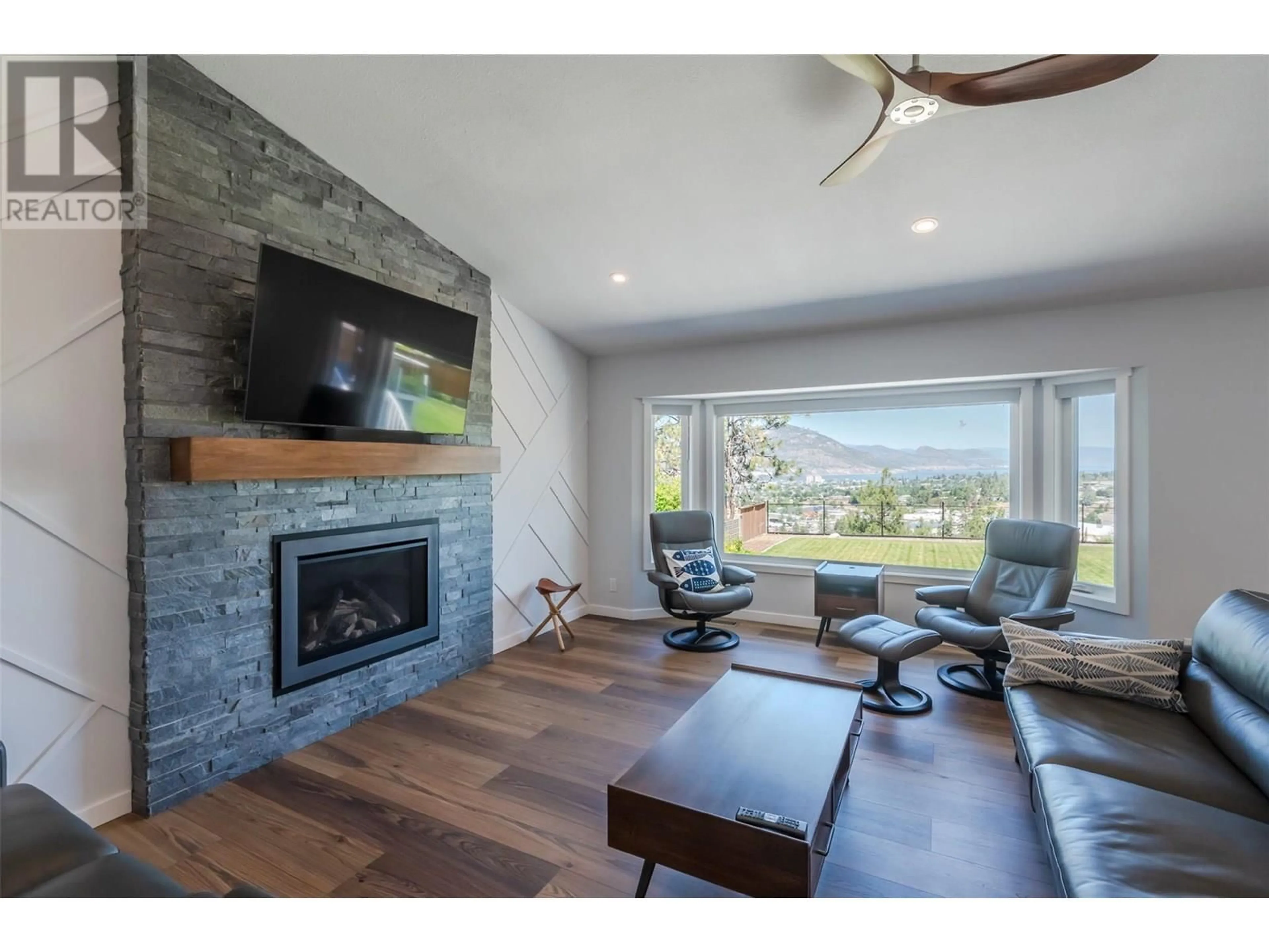 Living room with furniture, wood/laminate floor for 153 WESTVIEW DRIVE, Penticton British Columbia V2A7V9