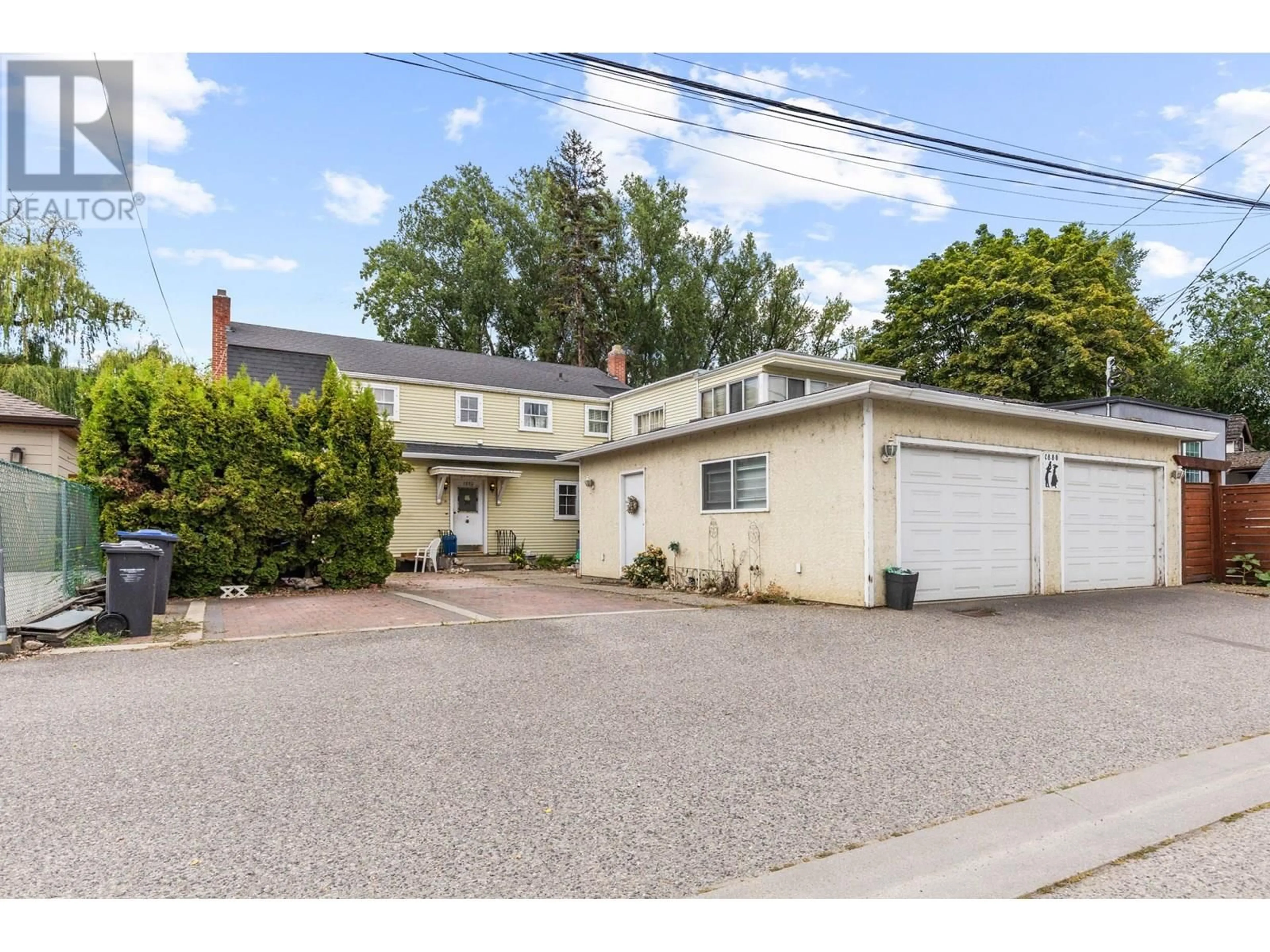 A pic from outside/outdoor area/front of a property/back of a property/a pic from drone, street for 1880 RIVERSIDE AVENUE, Kelowna British Columbia V1Y1A7