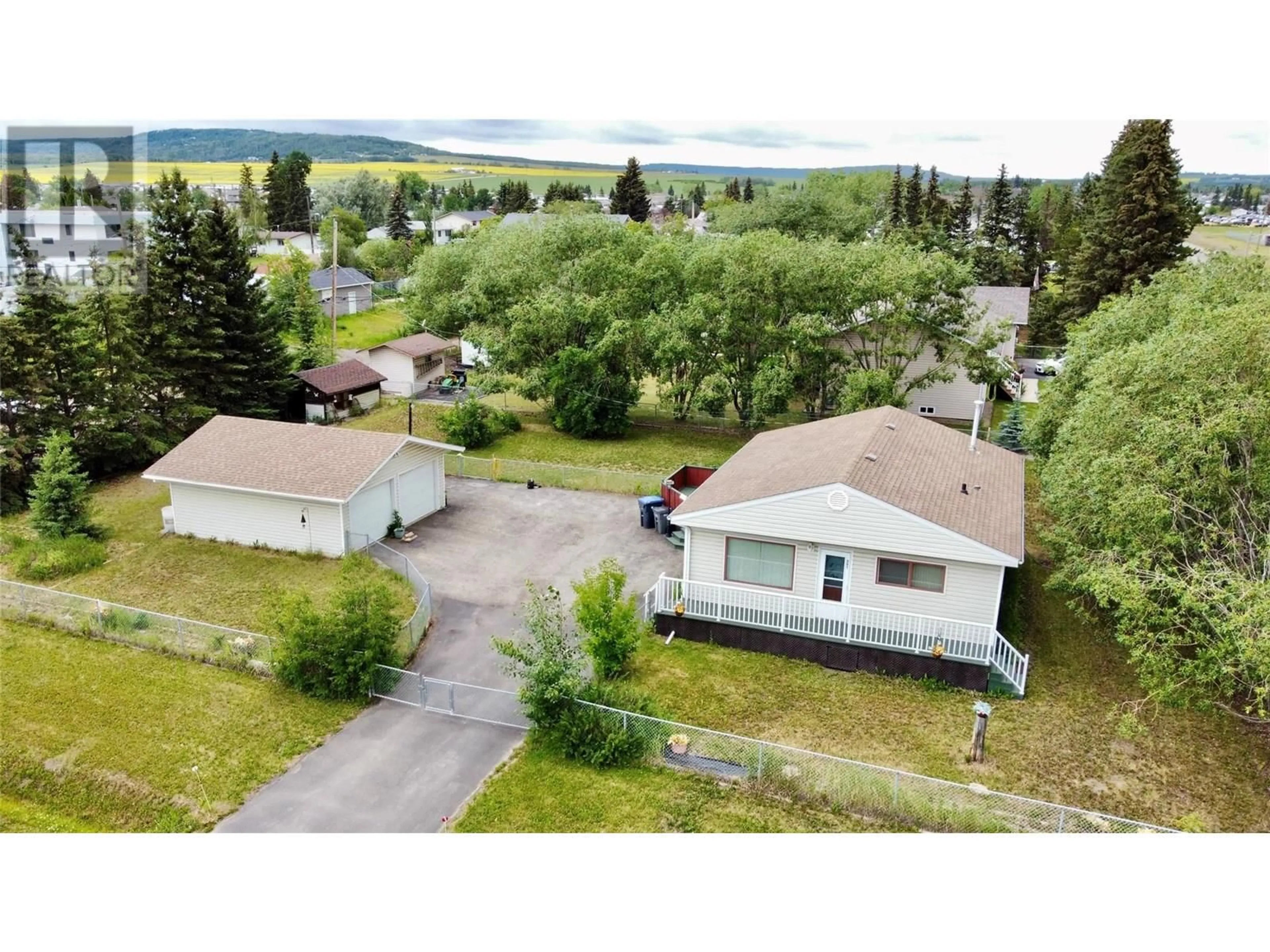 A pic from outside/outdoor area/front of a property/back of a property/a pic from drone, mountain view for 901 116 AVENUE, Dawson Creek British Columbia V1G3E3