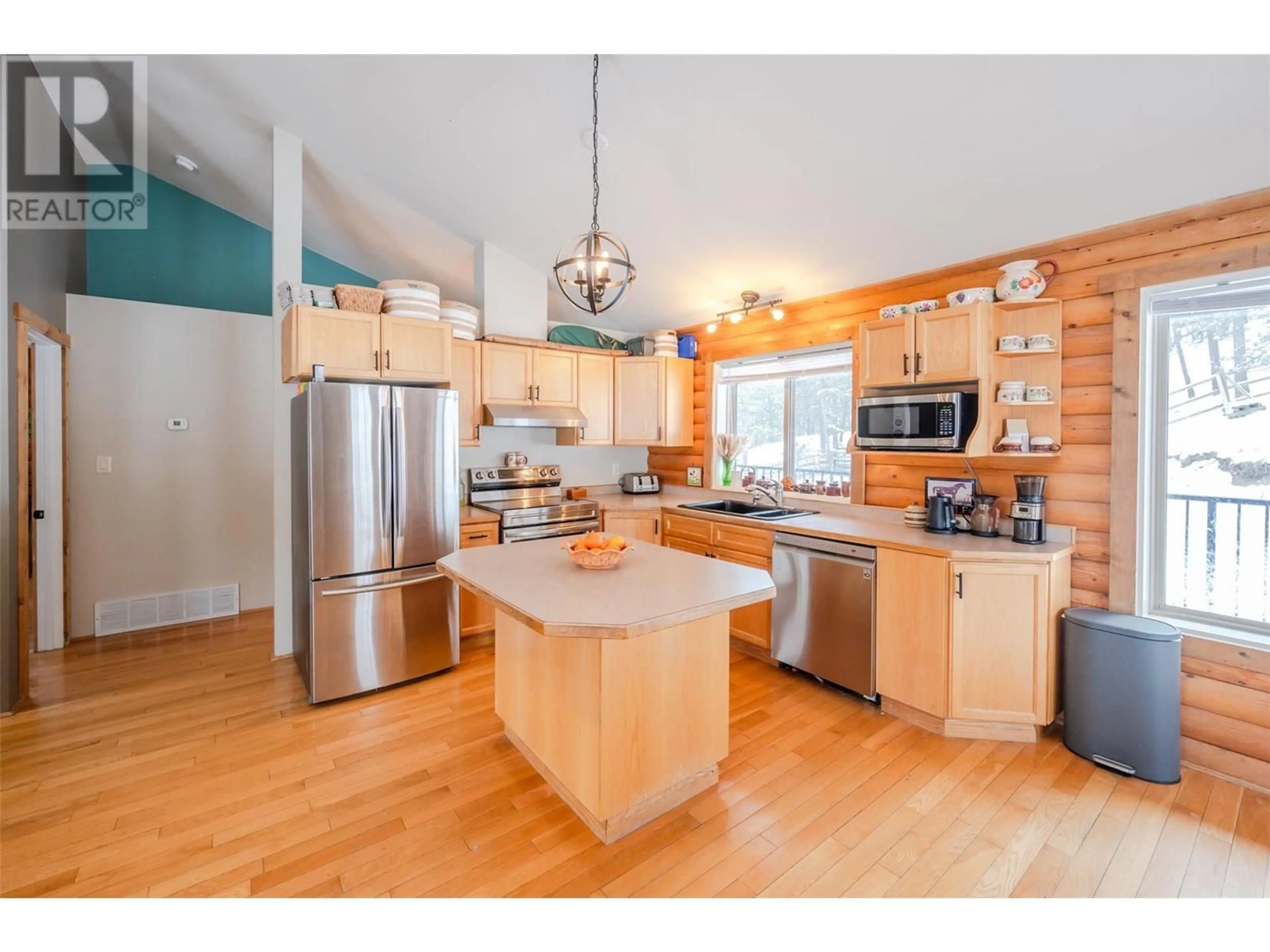 Open concept kitchen, wood/laminate floor for 105 SADDLEHORN DRIVE, Kaleden British Columbia V0H1K0