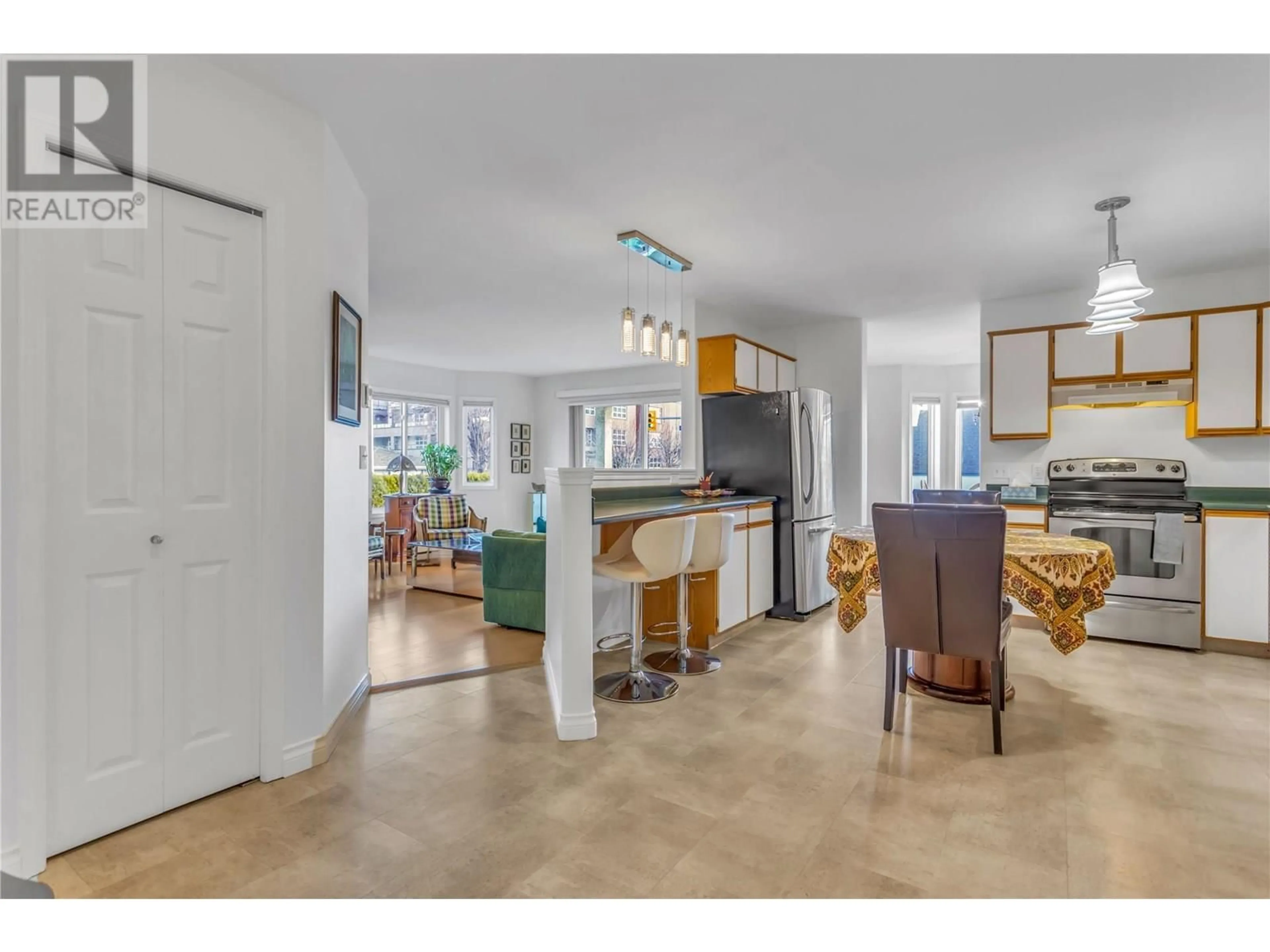 Open concept kitchen, ceramic/tile floor for 101 - 680 DOYLE AVENUE, Kelowna British Columbia V1Y9S2