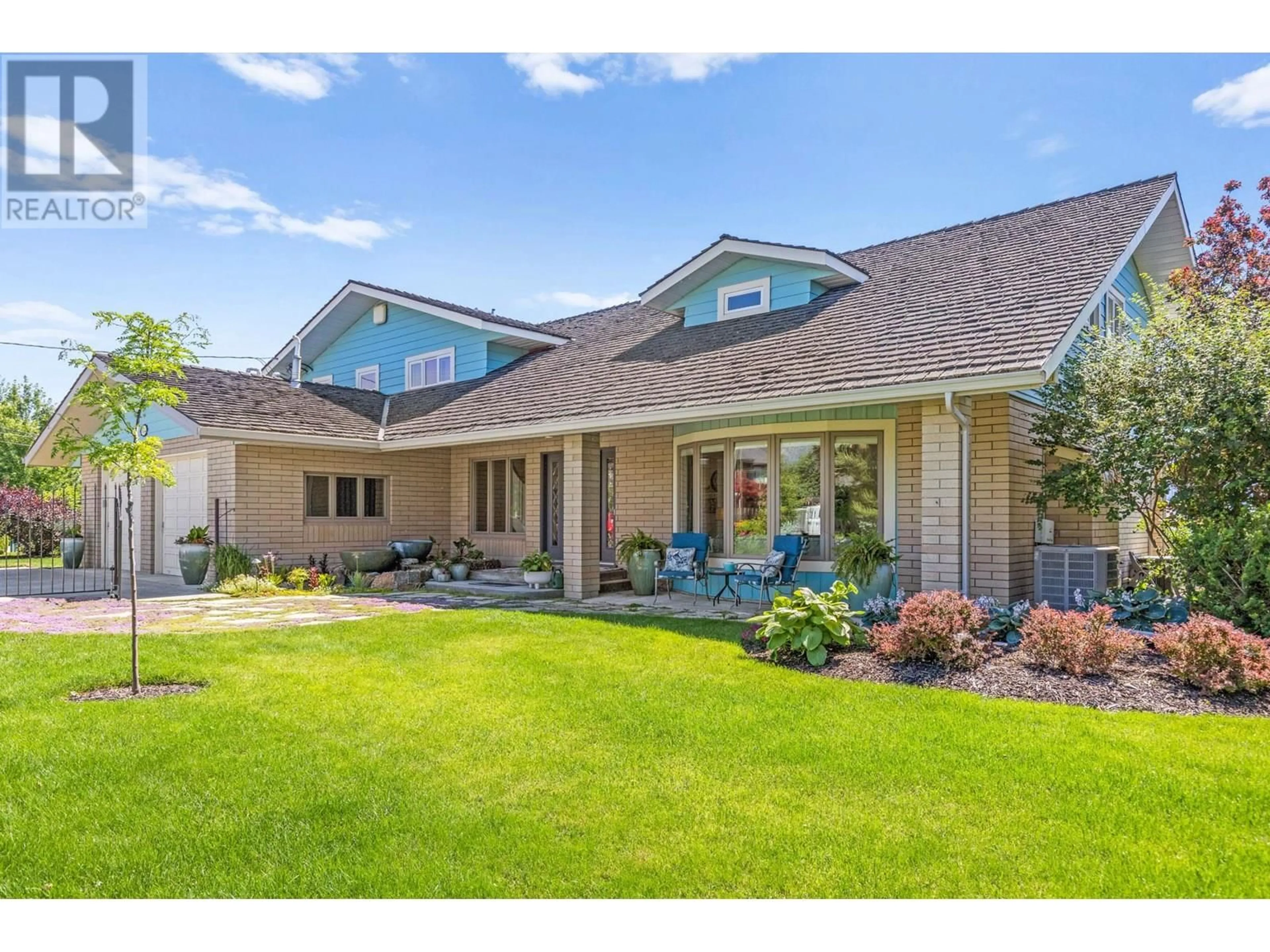 Home with vinyl exterior material, street for 1601 PRITCHARD DRIVE, West Kelowna British Columbia V4T1X4