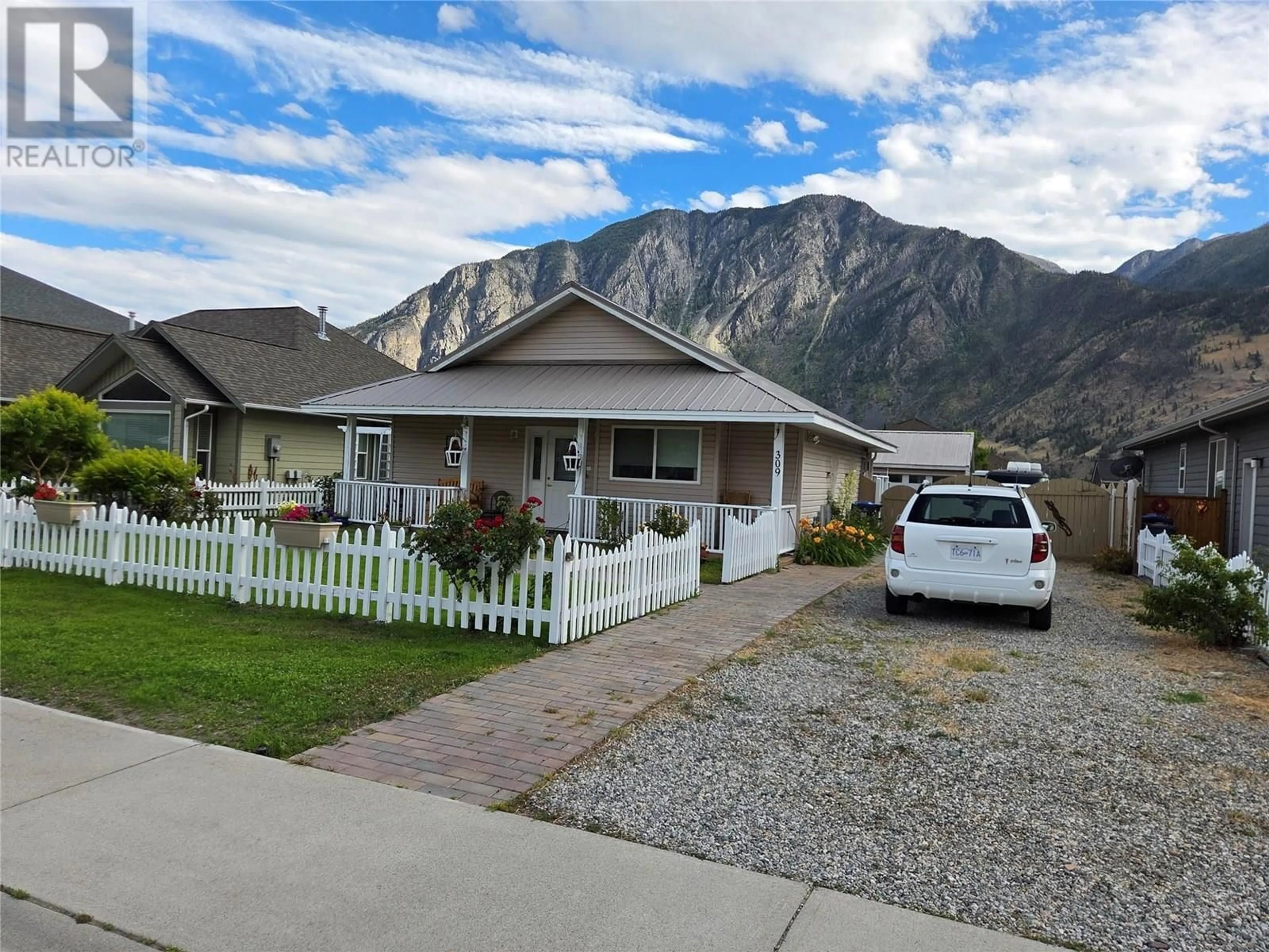 Home with vinyl exterior material, mountain view for 309 2ND AVENUE, Keremeos British Columbia V0X1N3