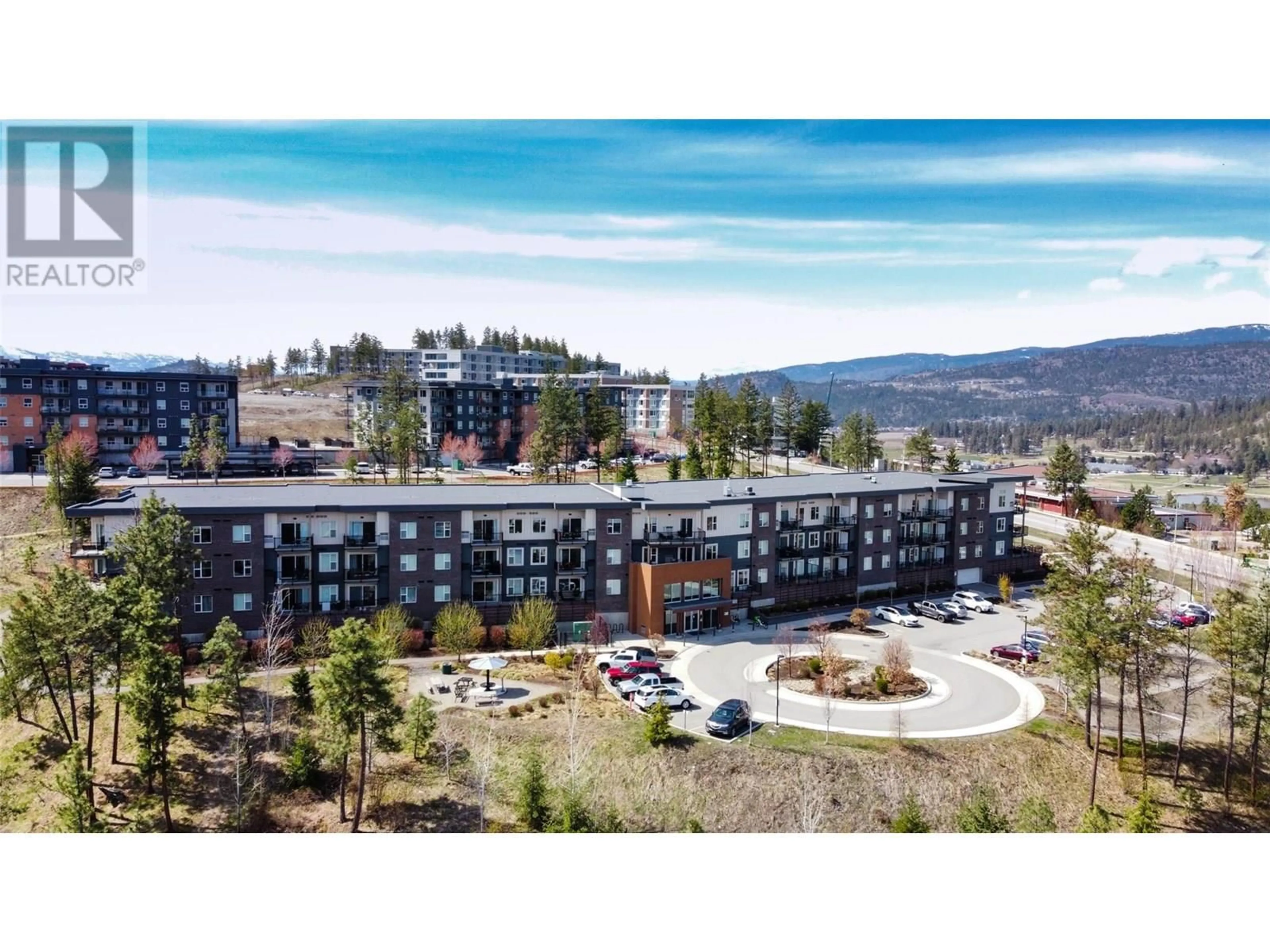 A pic from outside/outdoor area/front of a property/back of a property/a pic from drone, mountain view for 118 - 935 ACADEMY WAY, Kelowna British Columbia V1V3A9