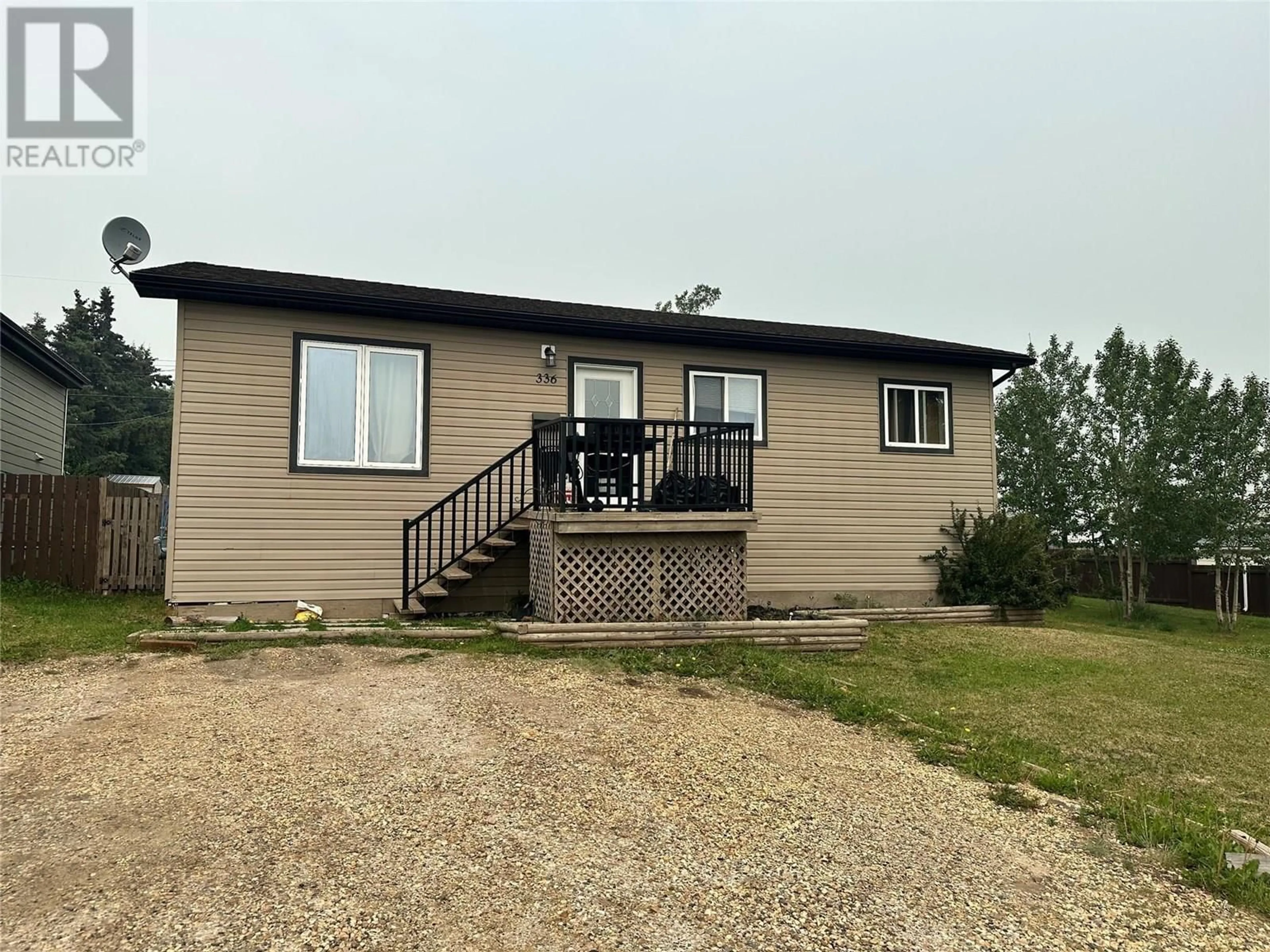 A pic from outside/outdoor area/front of a property/back of a property/a pic from drone, building for 336 98 AVENUE, Dawson Creek British Columbia V1G1R7
