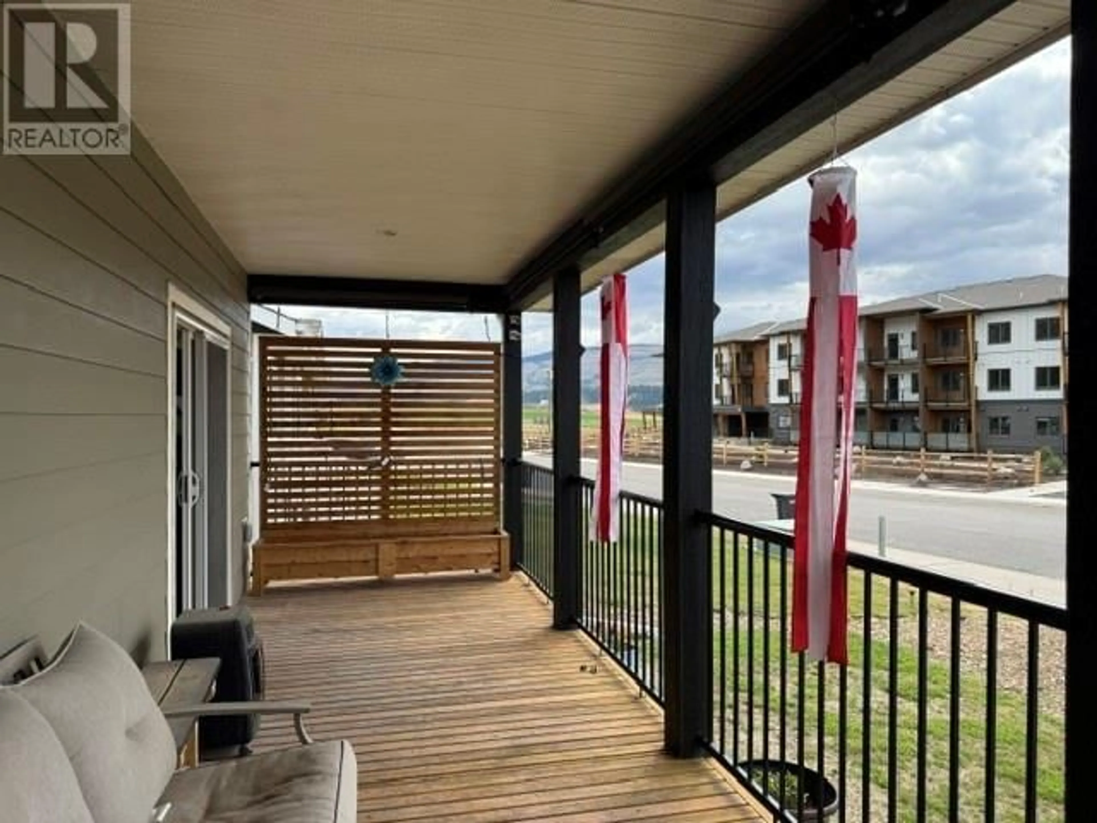 Balcony in the apartment, city buildings view from balcony for 2569 SPRING BANK AVENUE, Merritt British Columbia V1K1S1