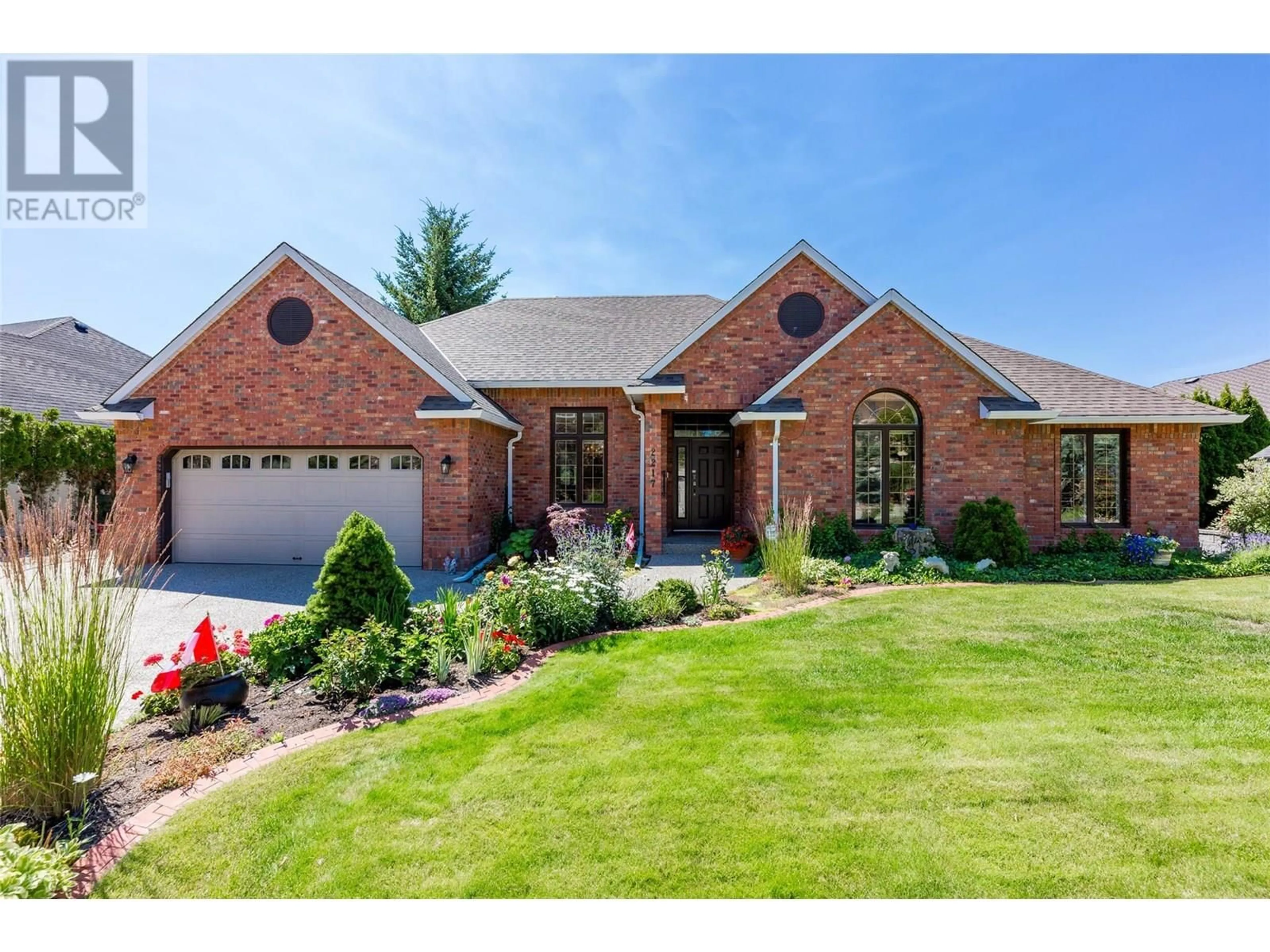 Home with brick exterior material, street for 2217 BRECKENRIDGE COURT, Kelowna British Columbia V1V1W2