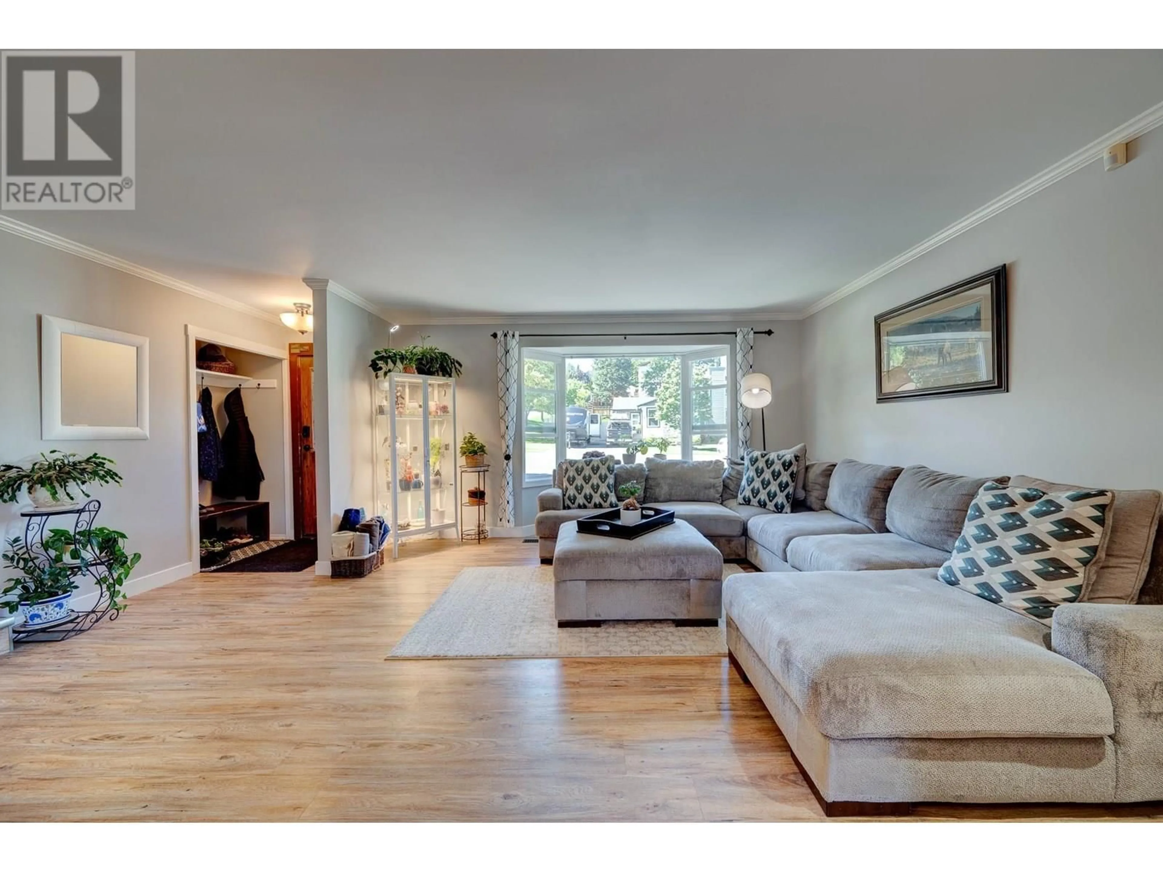 Living room with furniture, wood/laminate floor for 146 WHISTLER DRIVE, Kamloops British Columbia V2E1X6