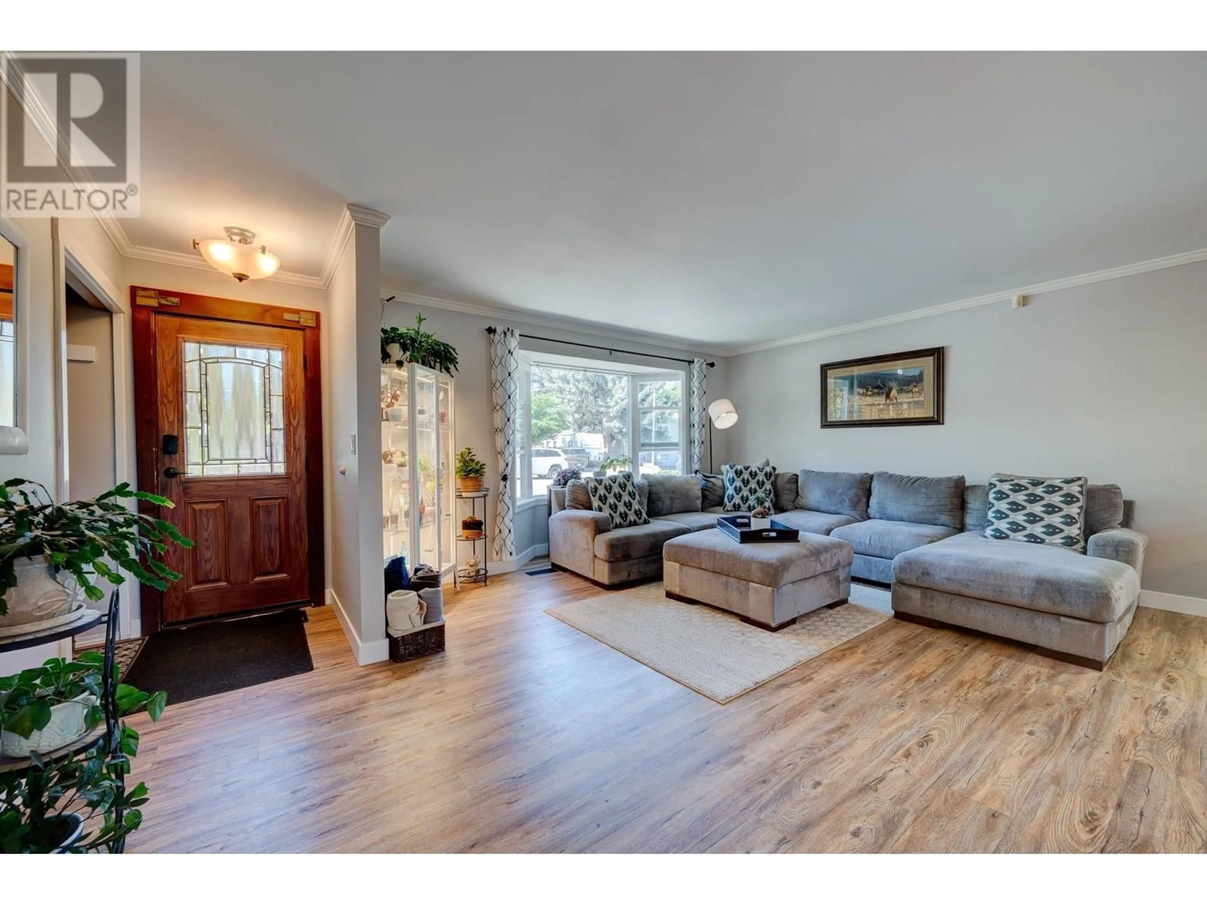 Living room with furniture, wood/laminate floor for 146 WHISTLER DRIVE, Kamloops British Columbia V2E1X6