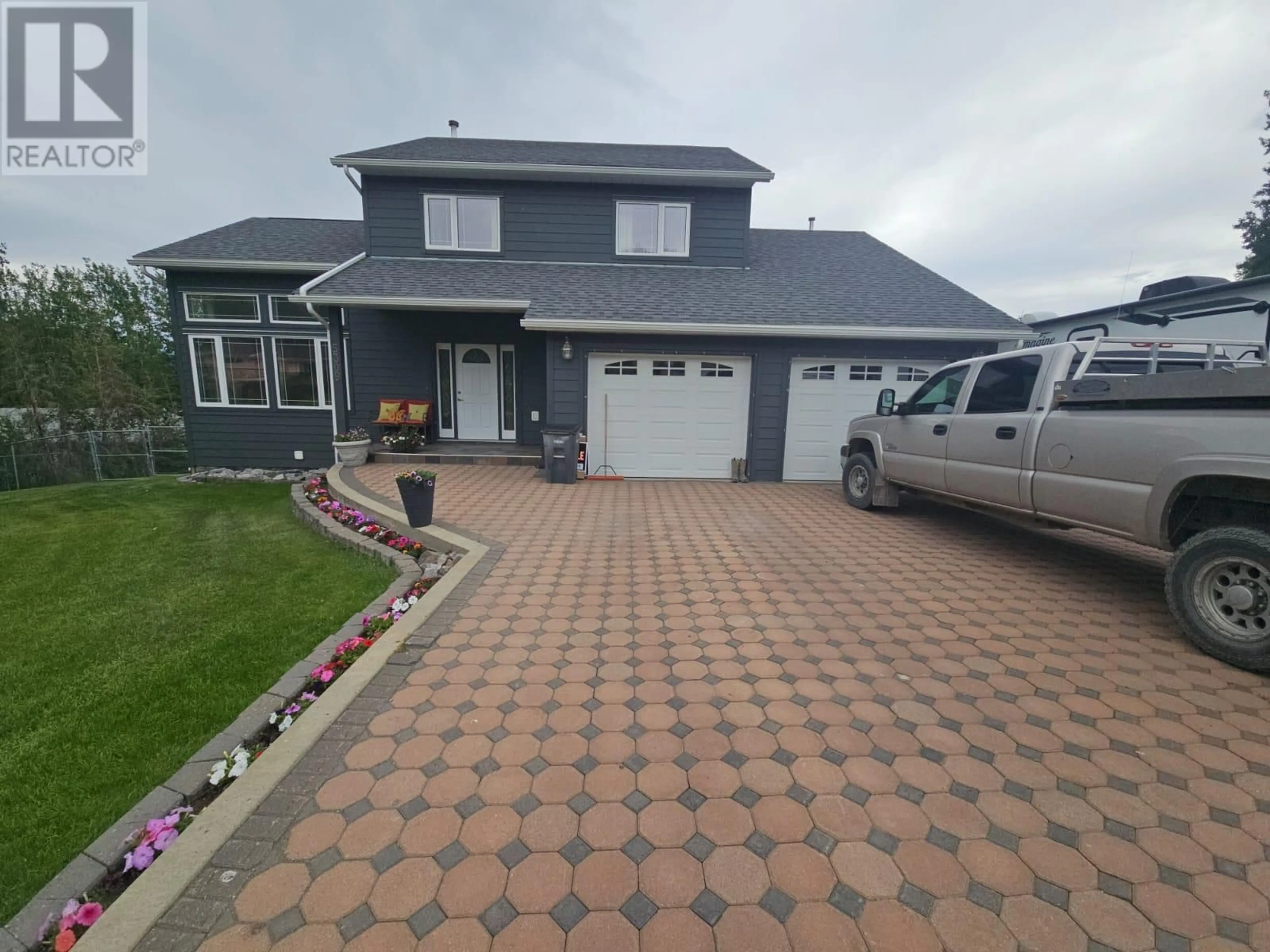 Home with vinyl exterior material, street for 5309 HILLSIDE AVENUE NORTHWEST, Chetwynd British Columbia V0C1J0