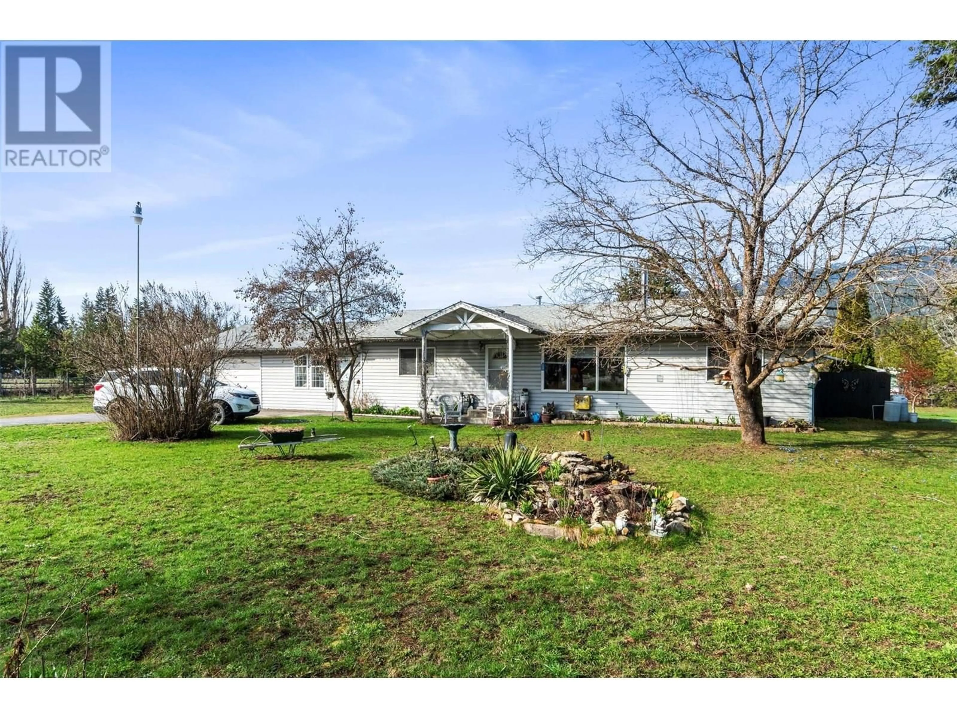 A pic from outside/outdoor area/front of a property/back of a property/a pic from drone, street for 7024 HIGHWAY 97-B HIGHWAY, Salmon Arm British Columbia V0E2Y6