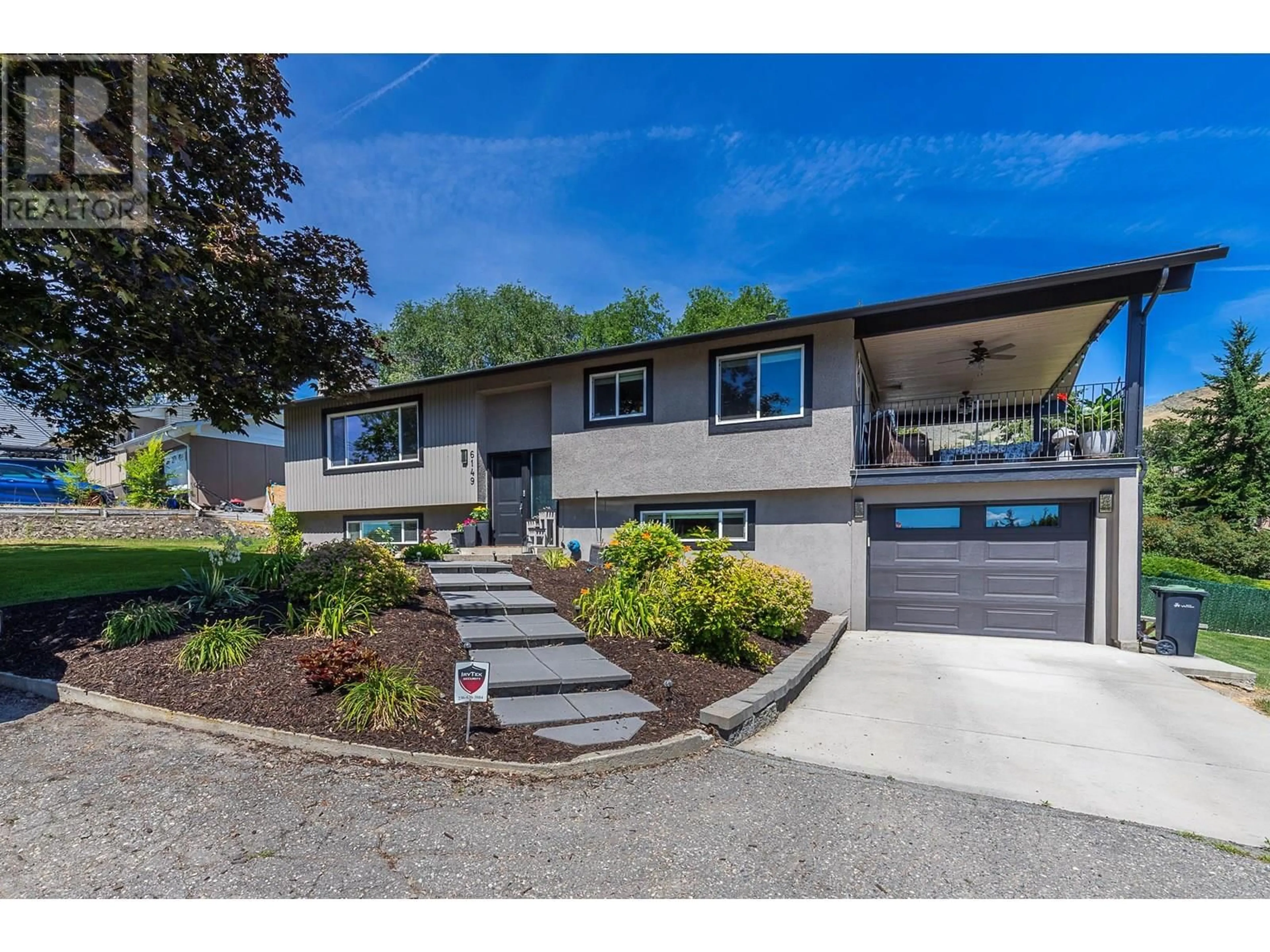 Home with vinyl exterior material, street for 6149 BELLA VISTA ROAD, Vernon British Columbia V1H1B4