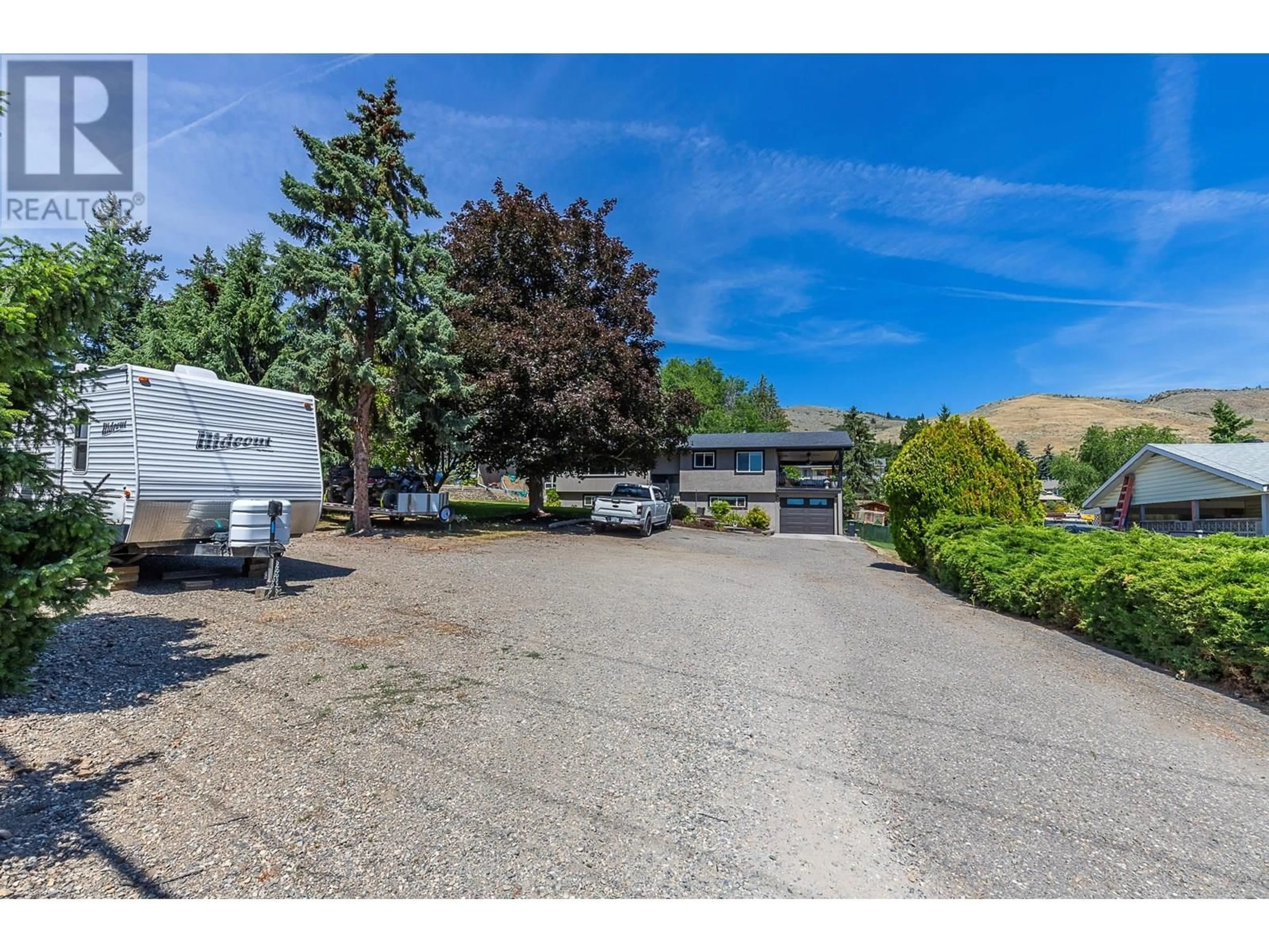 A pic from outside/outdoor area/front of a property/back of a property/a pic from drone, street for 6149 BELLA VISTA ROAD, Vernon British Columbia V1H1B4