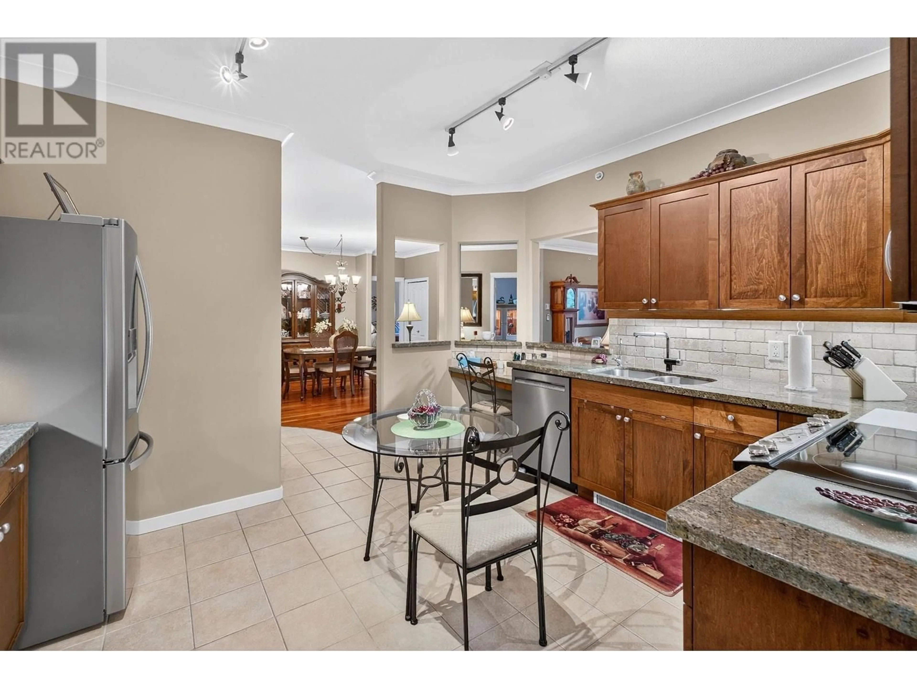 Open concept kitchen, ceramic/tile floor for 405 - 307 WHITMAN ROAD, Kelowna British Columbia V1V2P3
