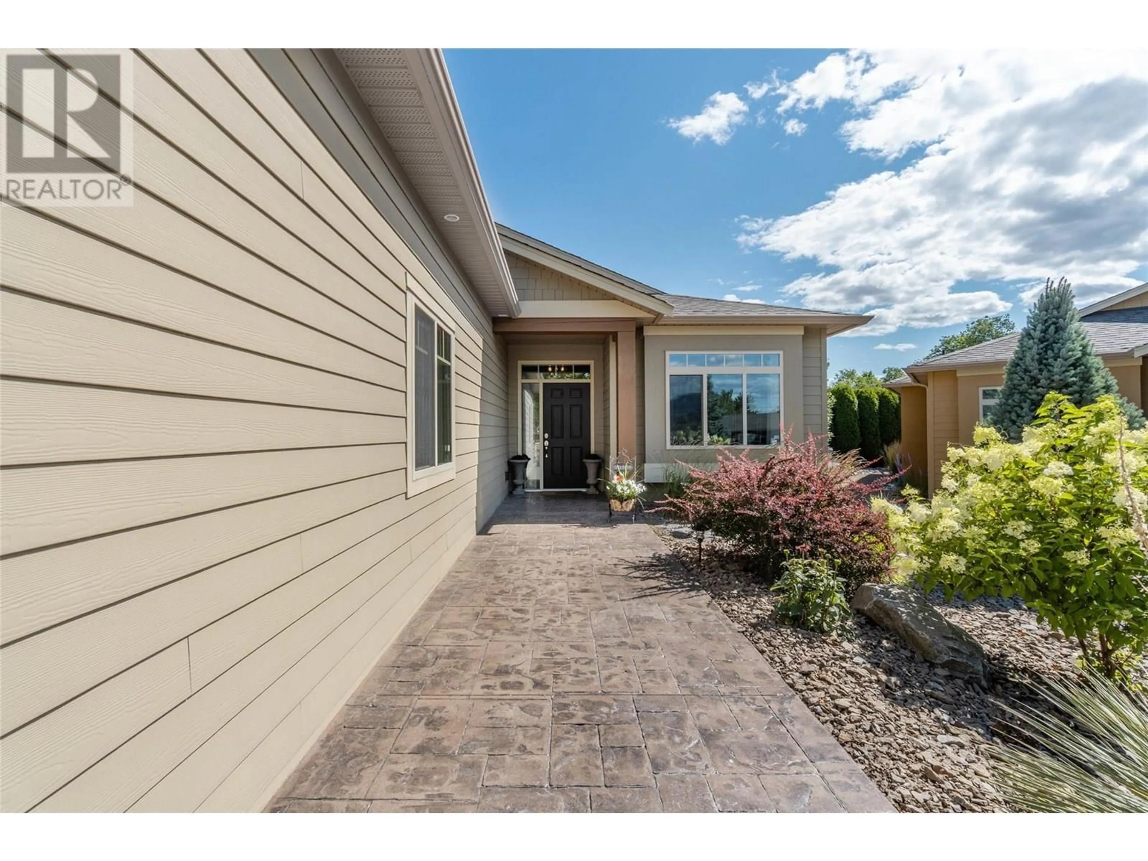 Home with vinyl exterior material, street for 24 - 6833 MEADOWS DRIVE, Oliver British Columbia V0H1T4