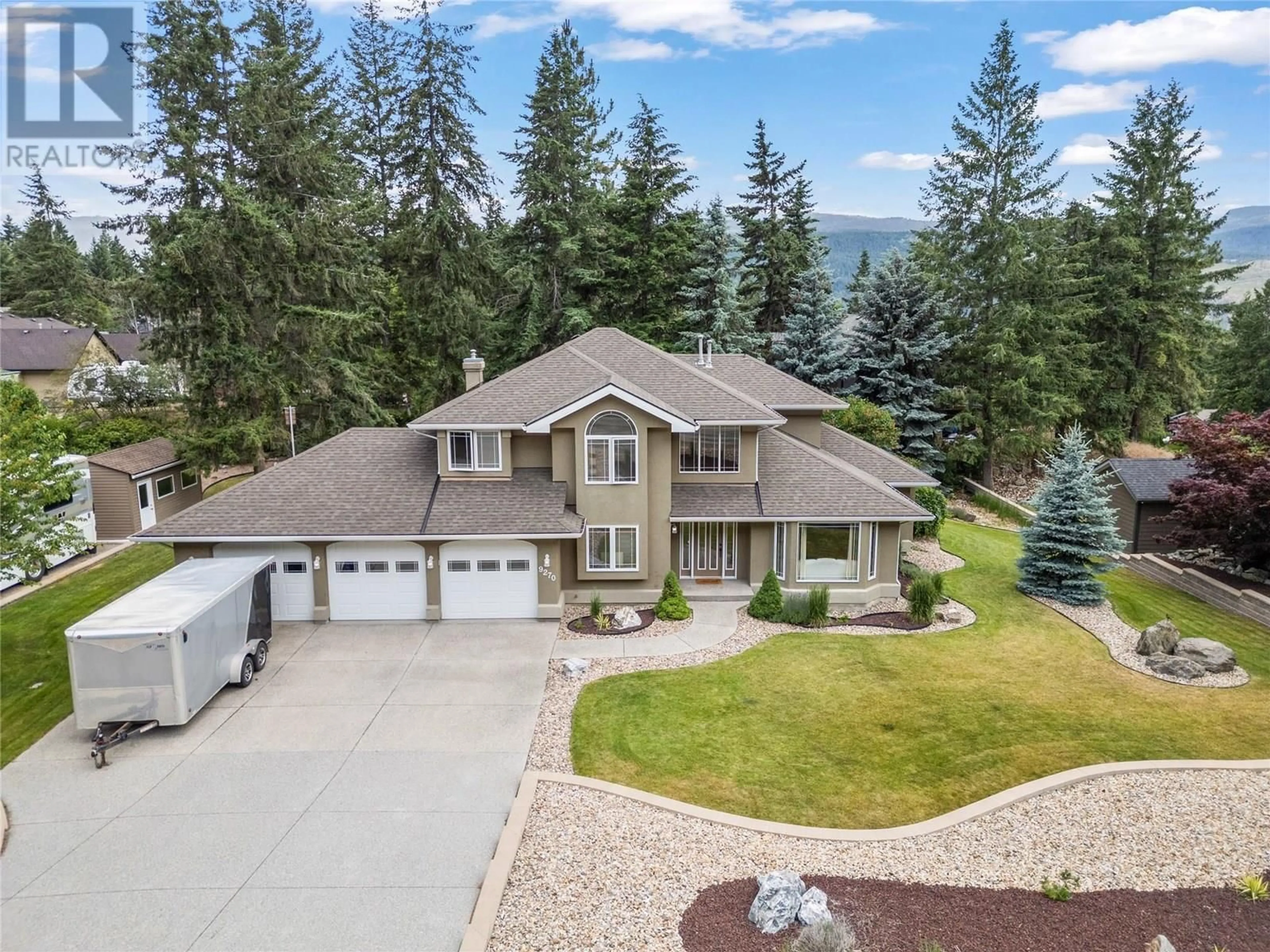 A pic from outside/outdoor area/front of a property/back of a property/a pic from drone, mountain view for 9270 TRONSON ROAD, Vernon British Columbia V1H1E3