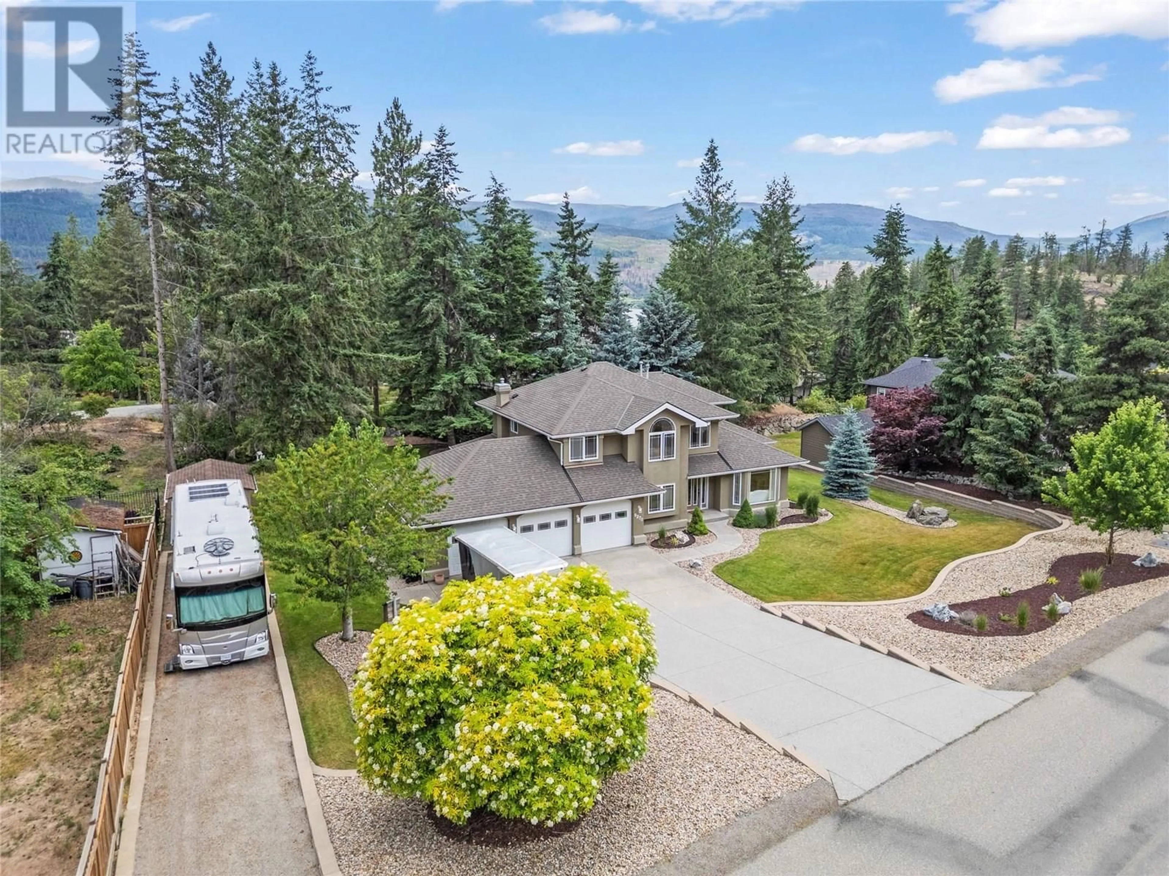 A pic from outside/outdoor area/front of a property/back of a property/a pic from drone, mountain view for 9270 TRONSON ROAD, Vernon British Columbia V1H1E3