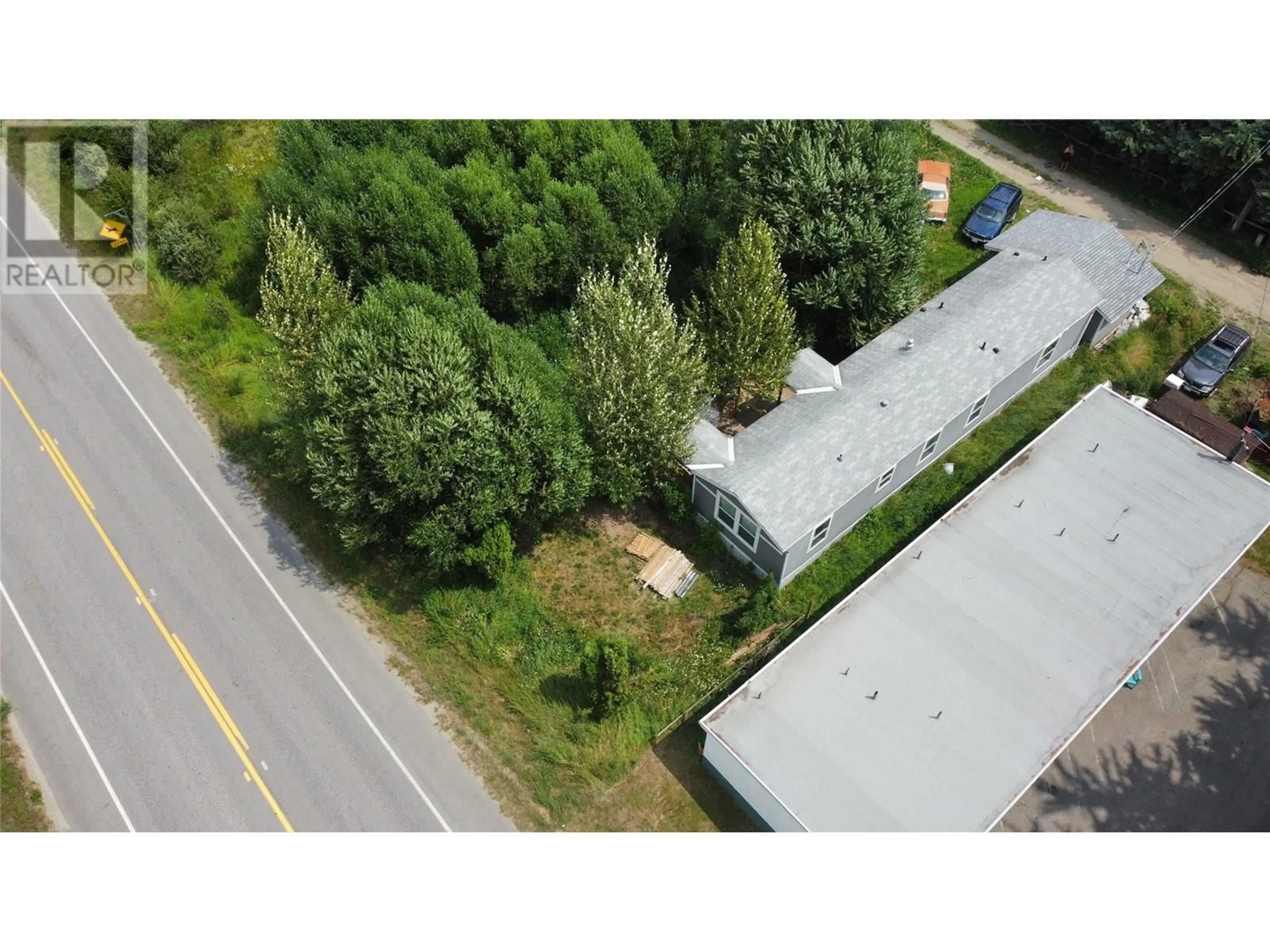 A pic from outside/outdoor area/front of a property/back of a property/a pic from drone, unknown for 115 RAILWAY AVENUE, Salmo British Columbia V0G1Z0