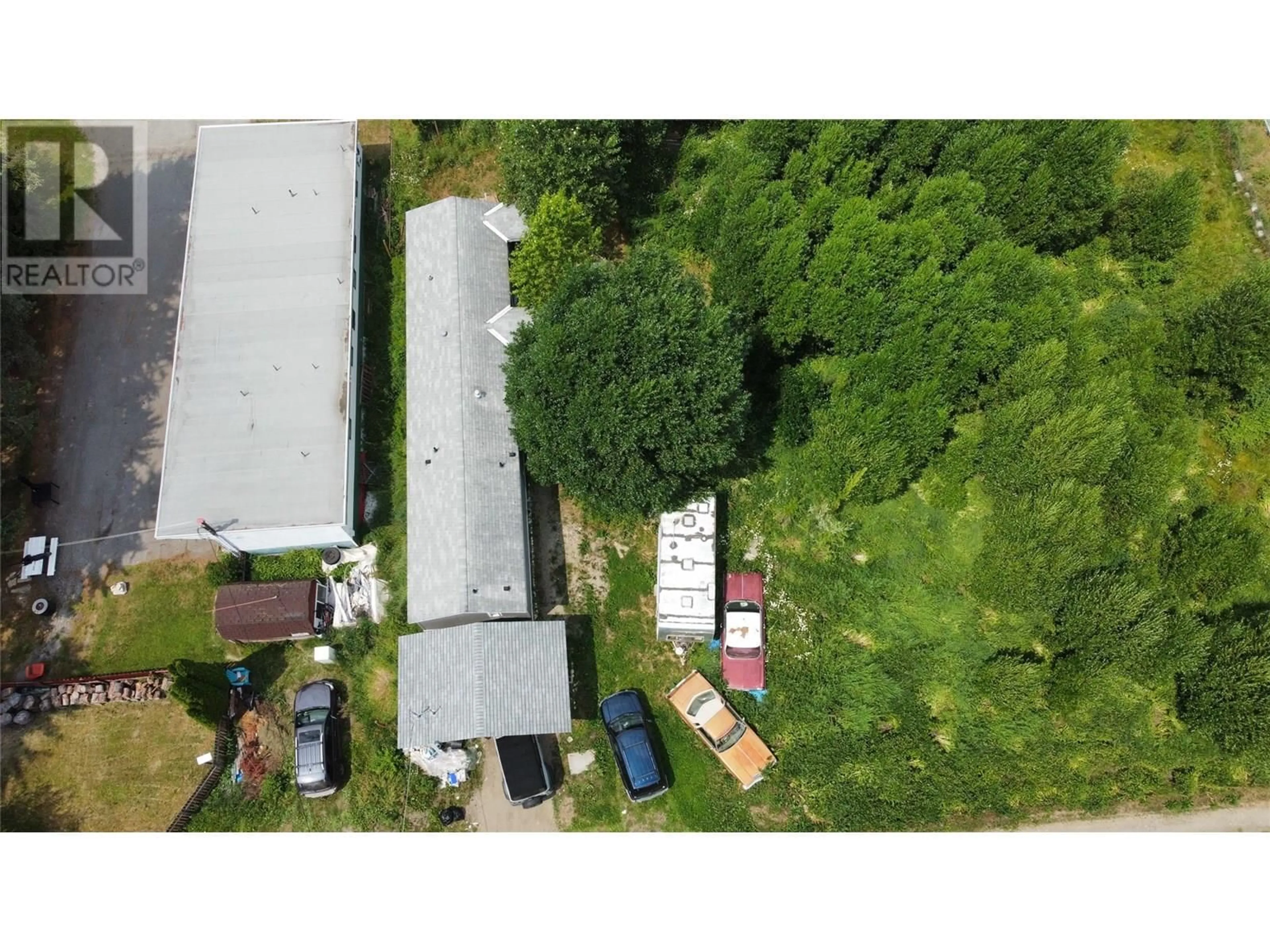 A pic from outside/outdoor area/front of a property/back of a property/a pic from drone, street for 115 RAILWAY AVENUE, Salmo British Columbia V0G1Z0