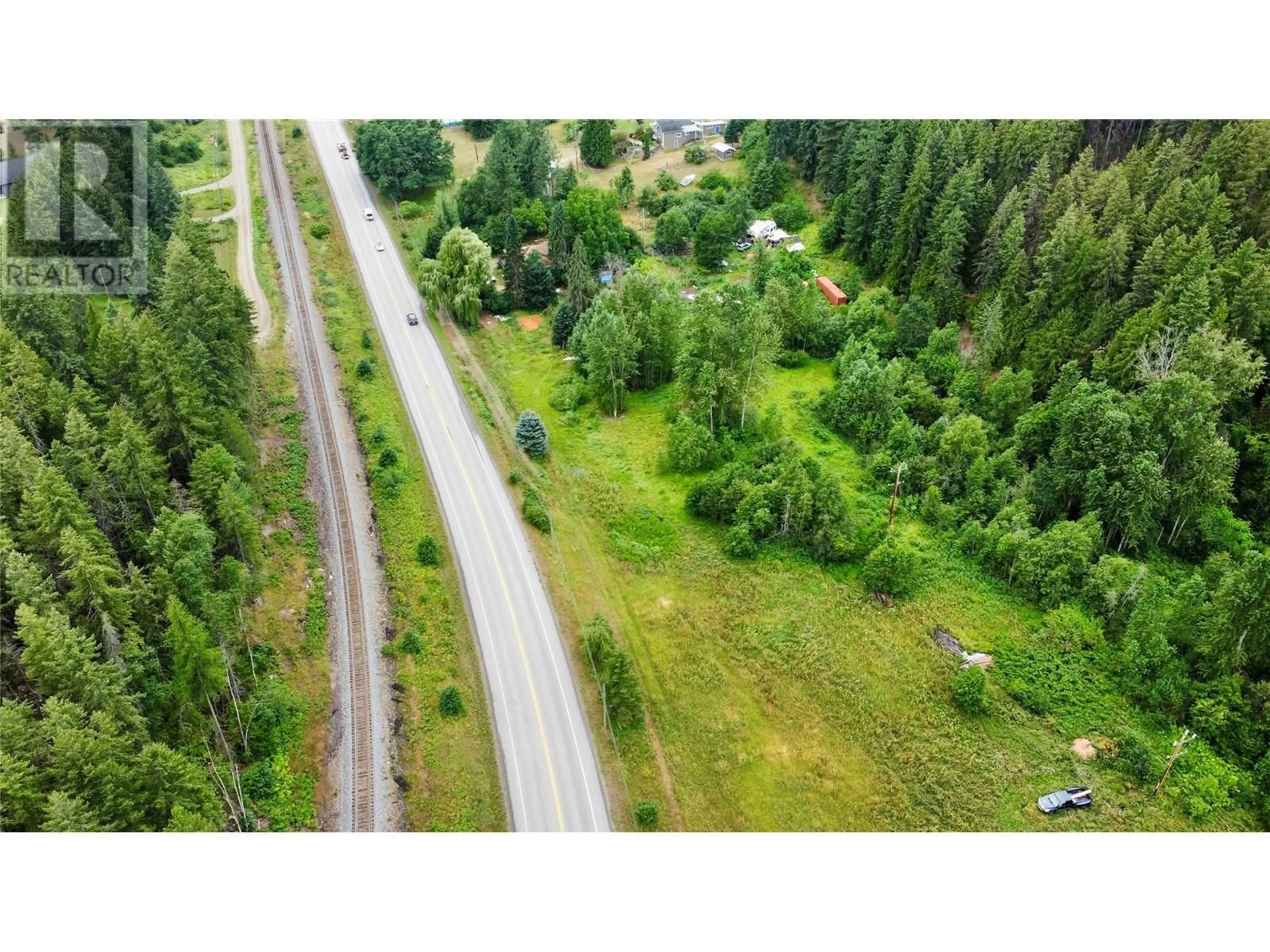 A pic from outside/outdoor area/front of a property/back of a property/a pic from drone, forest/trees view for 1765 HIGHWAY 3A HIGHWAY, Castlegar British Columbia V1N3H3