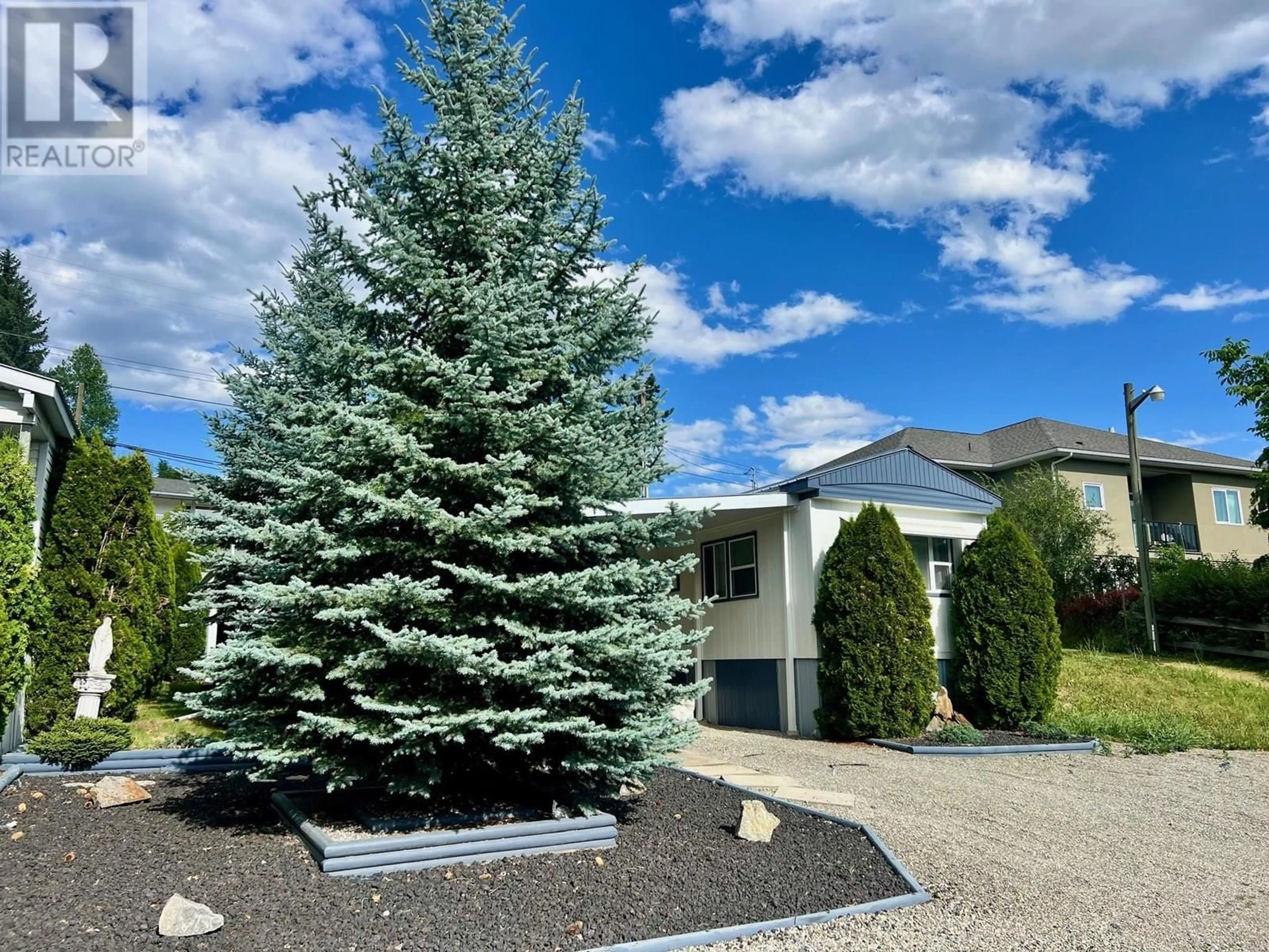 Home with vinyl exterior material, mountain view for 1 - 445 6TH AVENUE NORTH, Creston British Columbia V0B1G3