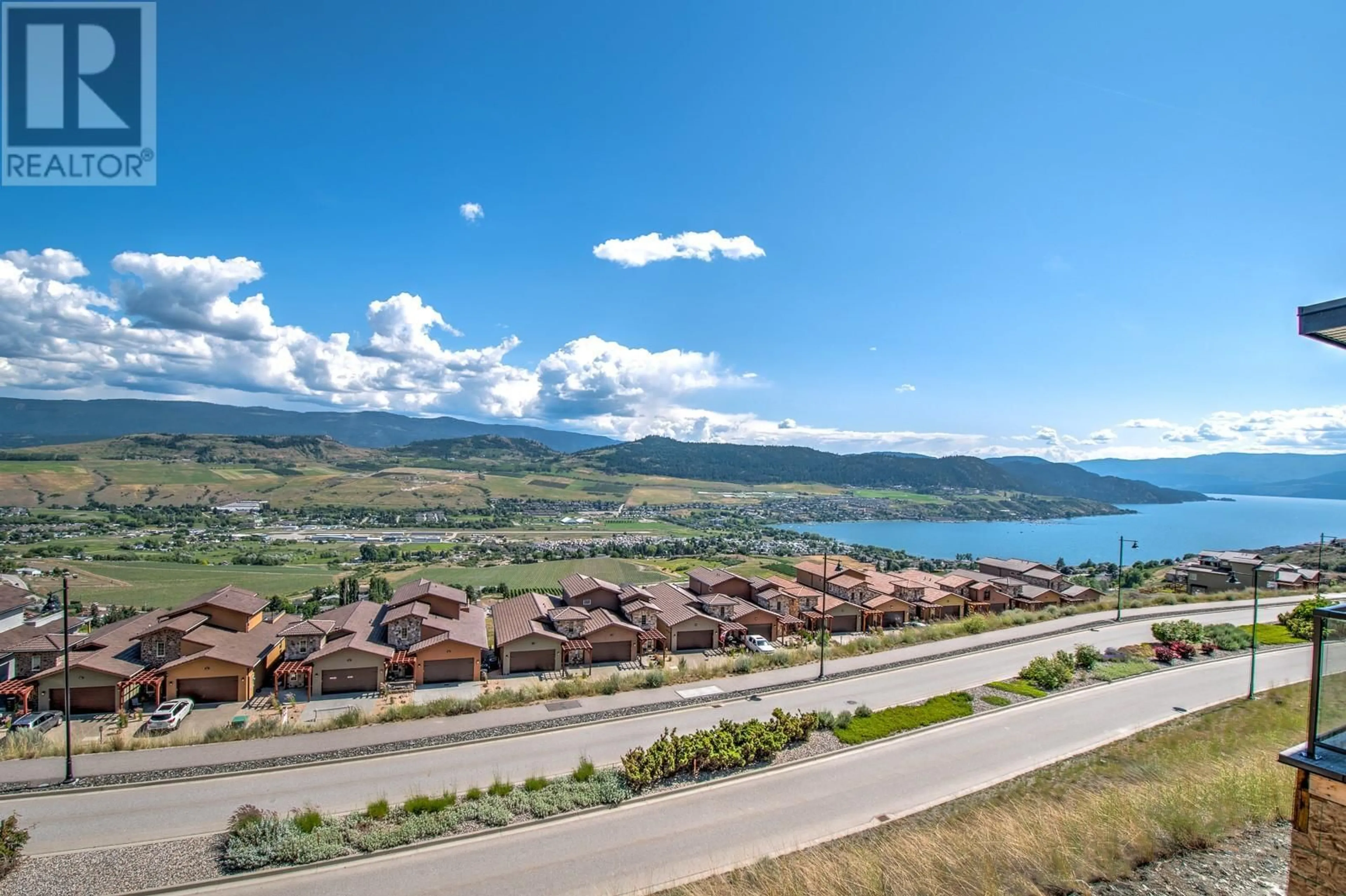 A pic from outside/outdoor area/front of a property/back of a property/a pic from drone, water/lake/river/ocean view for 20 - 7735 OKANAGAN HILLS BOULEVARD, Vernon British Columbia V1H0A7