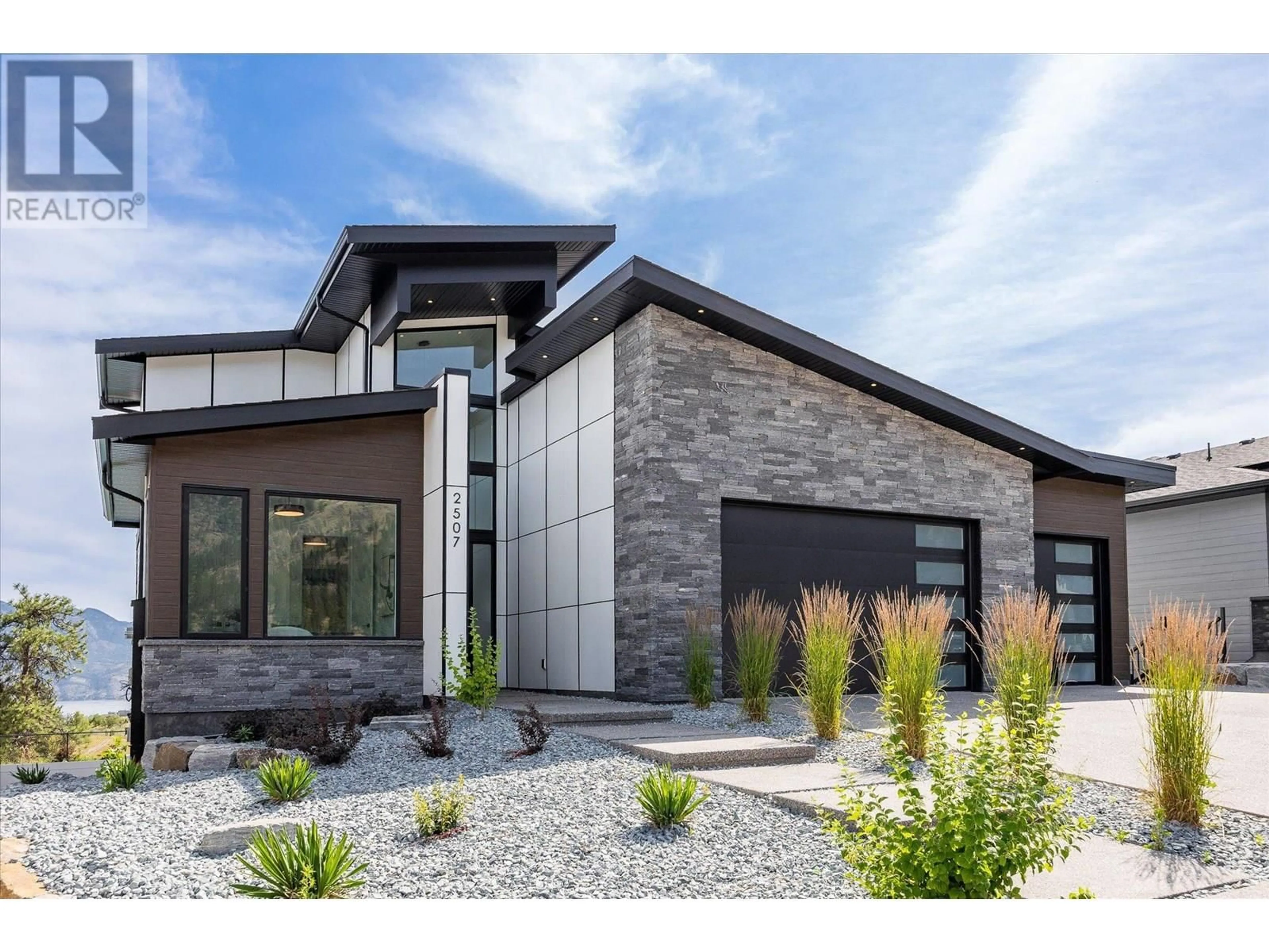Home with brick exterior material, street for 2507 PINNACLE RIDGE DRIVE, West Kelowna British Columbia V4T0E3