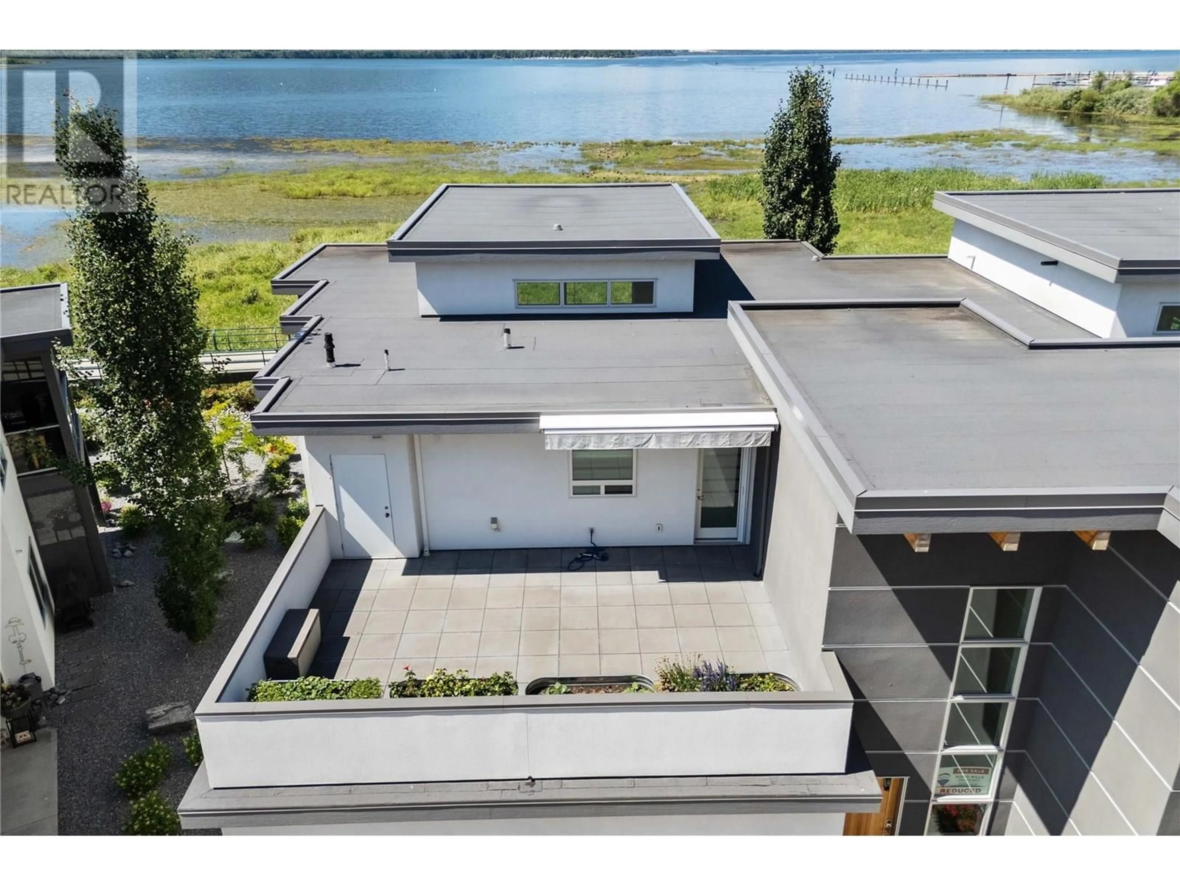 A pic from outside/outdoor area/front of a property/back of a property/a pic from drone, water/lake/river/ocean view for 10 - 121 HARBOURFRONT DRIVE NORTHEAST, Salmon Arm British Columbia V1E2T3