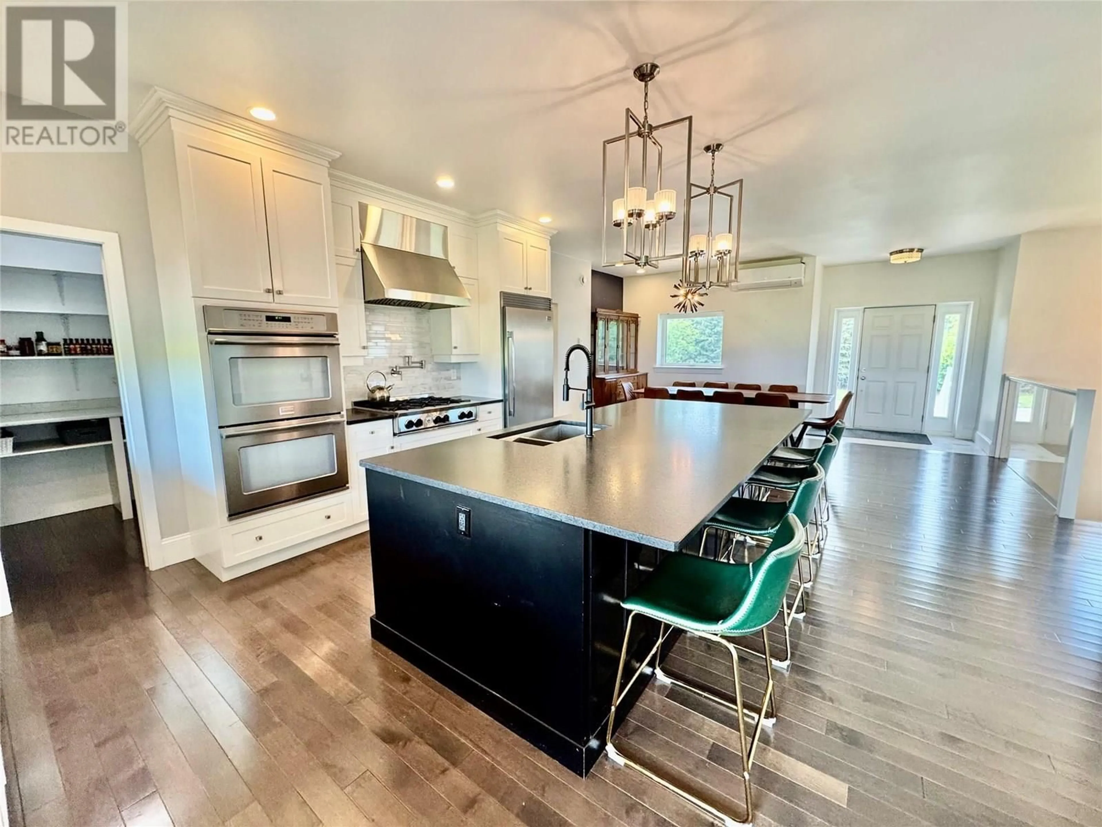 Open concept kitchen, wood/laminate floor for 6334 207 ROAD, Dawson Creek British Columbia V1G4E8