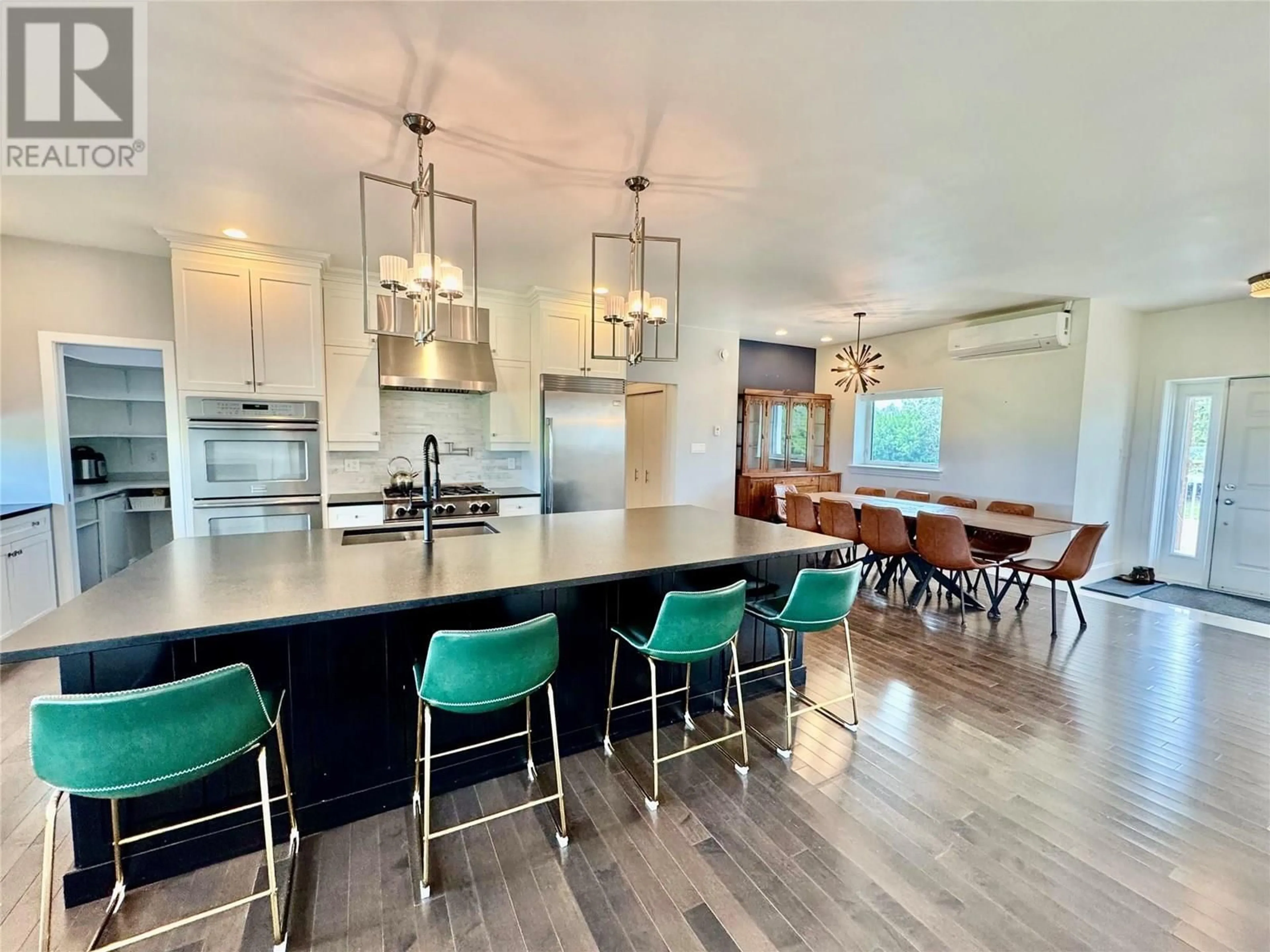 Open concept kitchen, wood/laminate floor for 6334 207 ROAD, Dawson Creek British Columbia V1G4E8