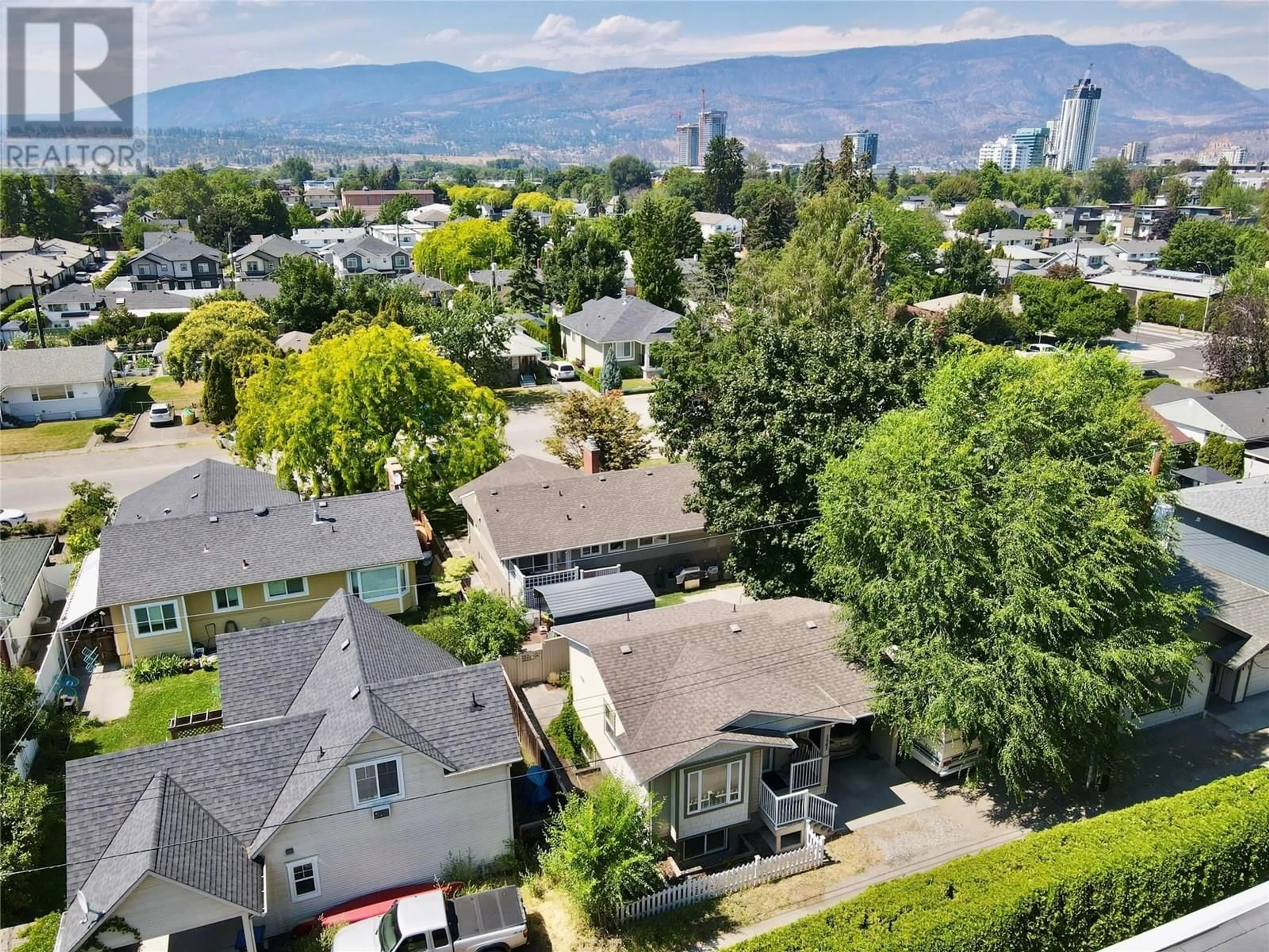 A pic from outside/outdoor area/front of a property/back of a property/a pic from drone, mountain view for 1945 BOWES STREET, Kelowna British Columbia V1Y3C2