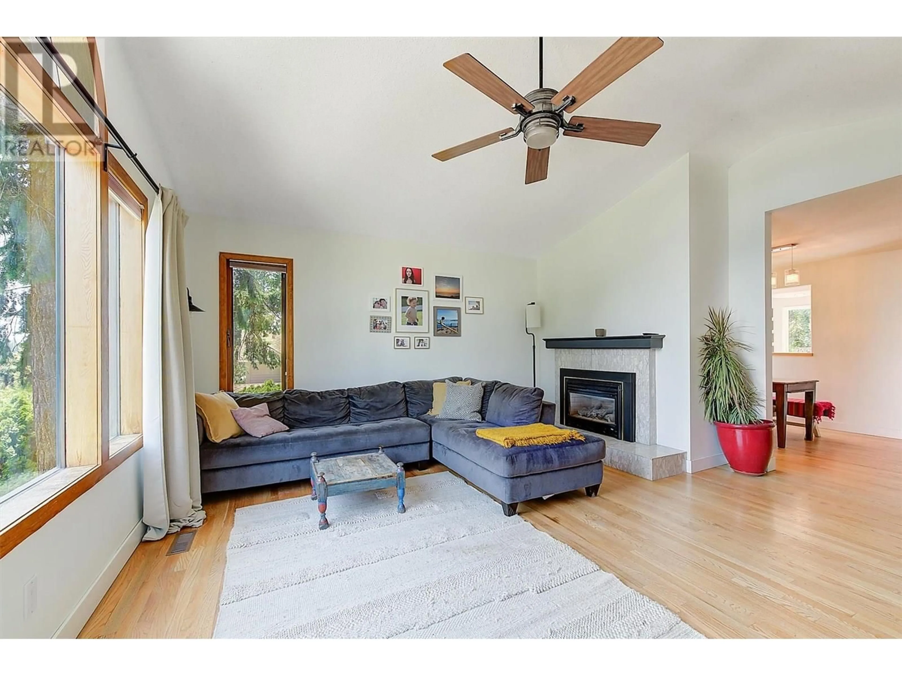 Living room with furniture, wood/laminate floor for 1612 WEST KELOWNA ROAD, West Kelowna British Columbia V1Z3B7
