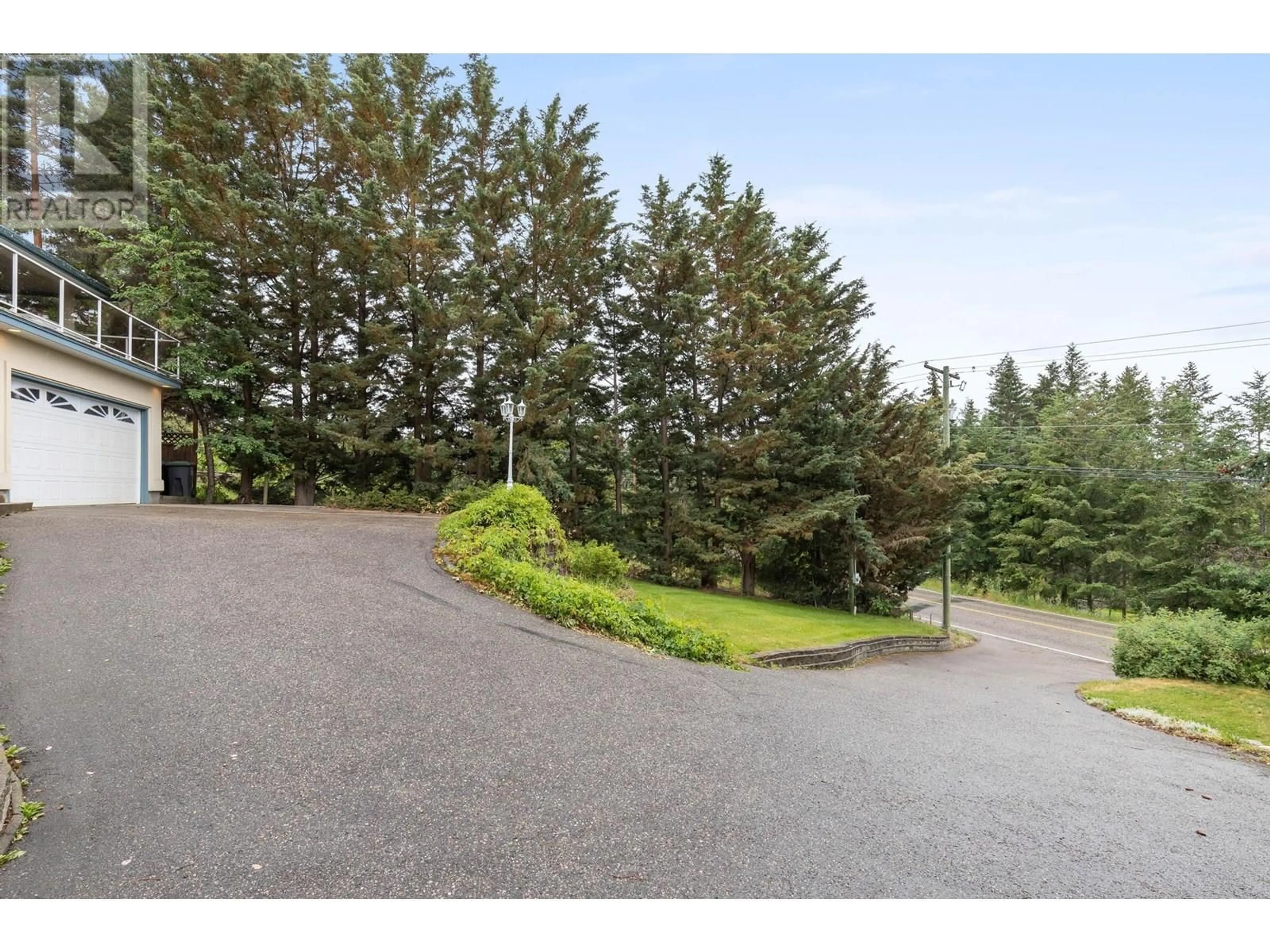 A pic from outside/outdoor area/front of a property/back of a property/a pic from drone, forest/trees view for 12857 OYAMA ROAD, Lake Country British Columbia V4V2A7