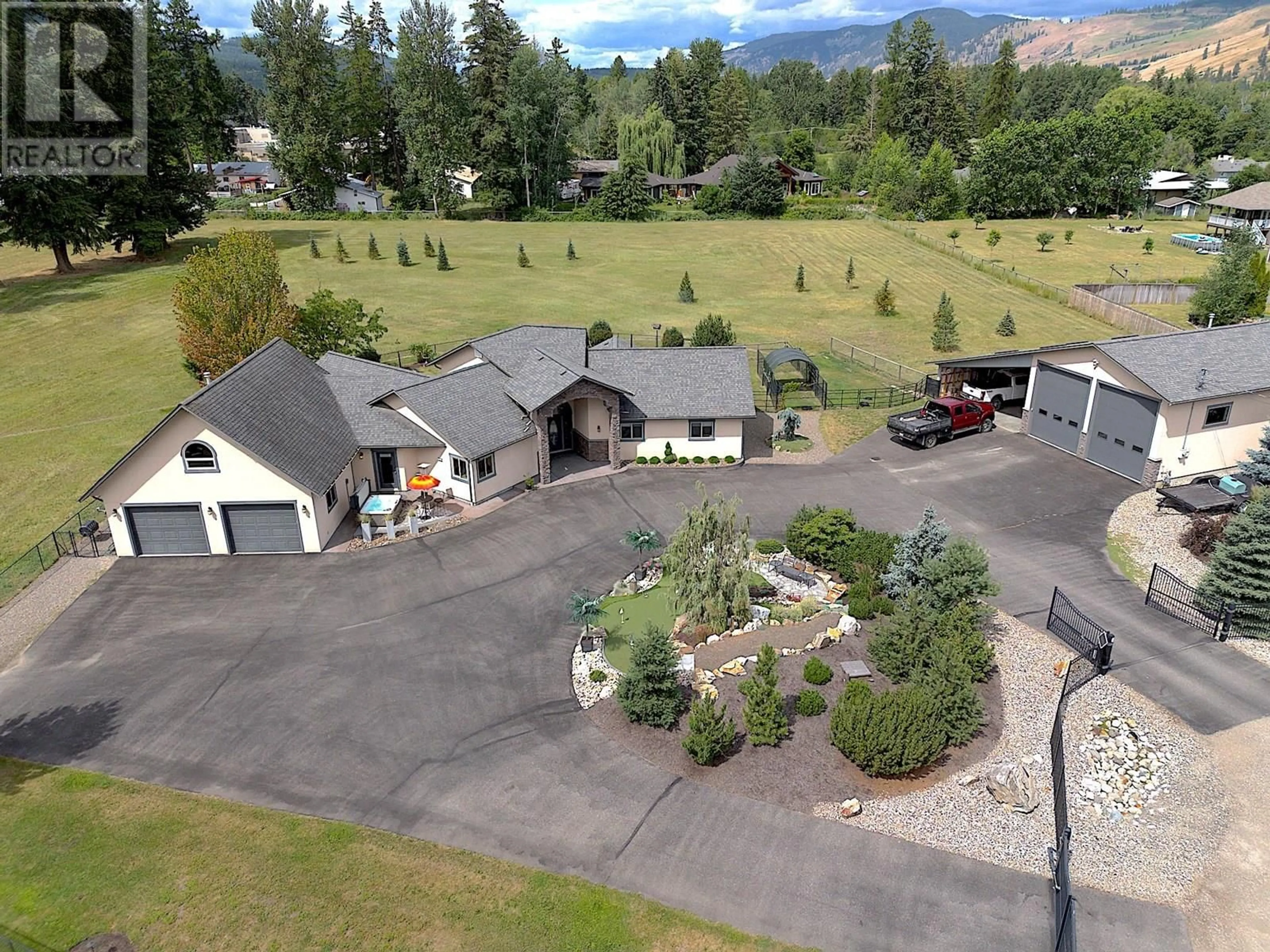 A pic from outside/outdoor area/front of a property/back of a property/a pic from drone, mountain view for 384 KYRO ROAD, Lumby British Columbia V0E2G7