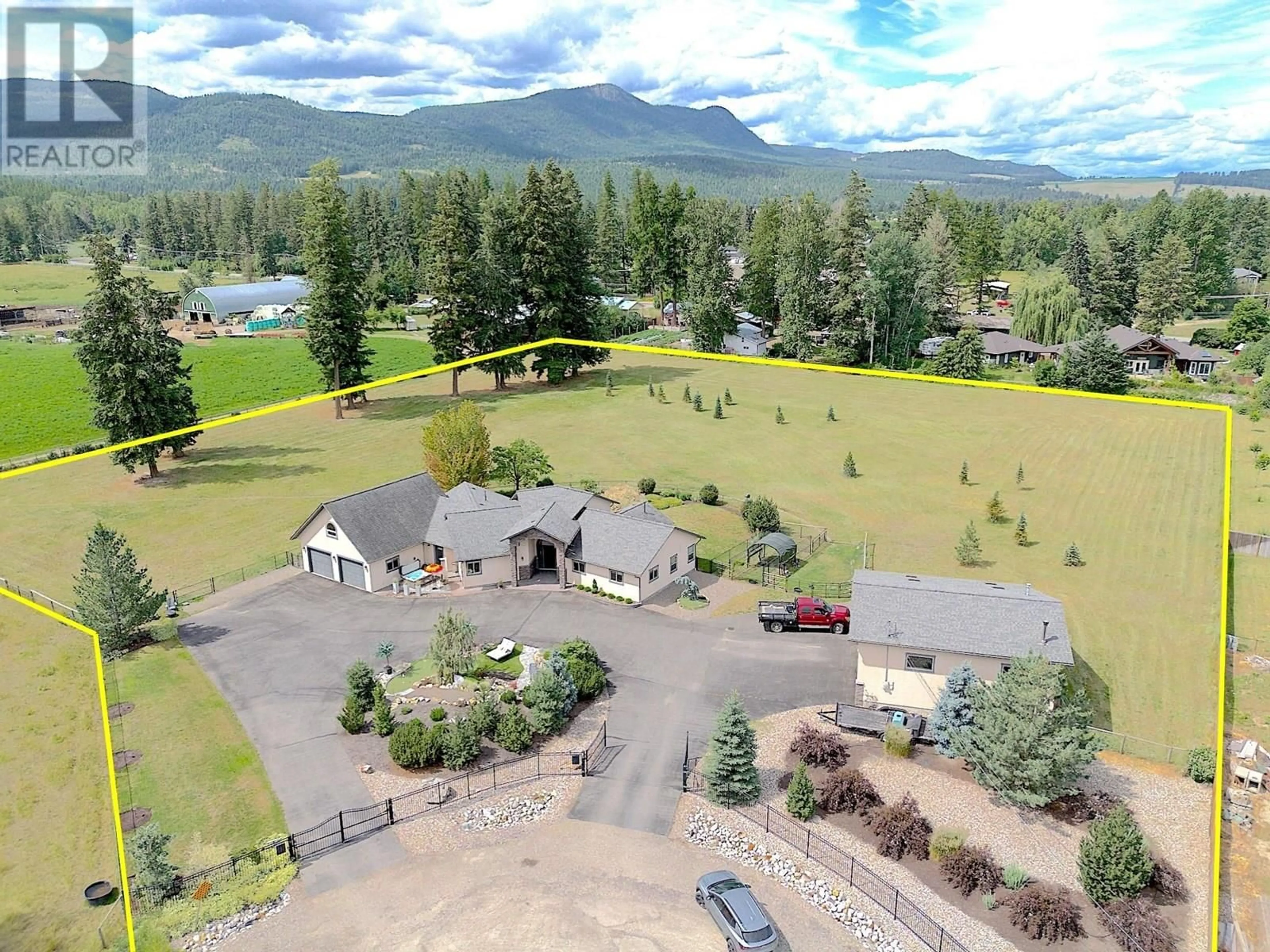 A pic from outside/outdoor area/front of a property/back of a property/a pic from drone, mountain view for 384 KYRO ROAD, Lumby British Columbia V0E2G7