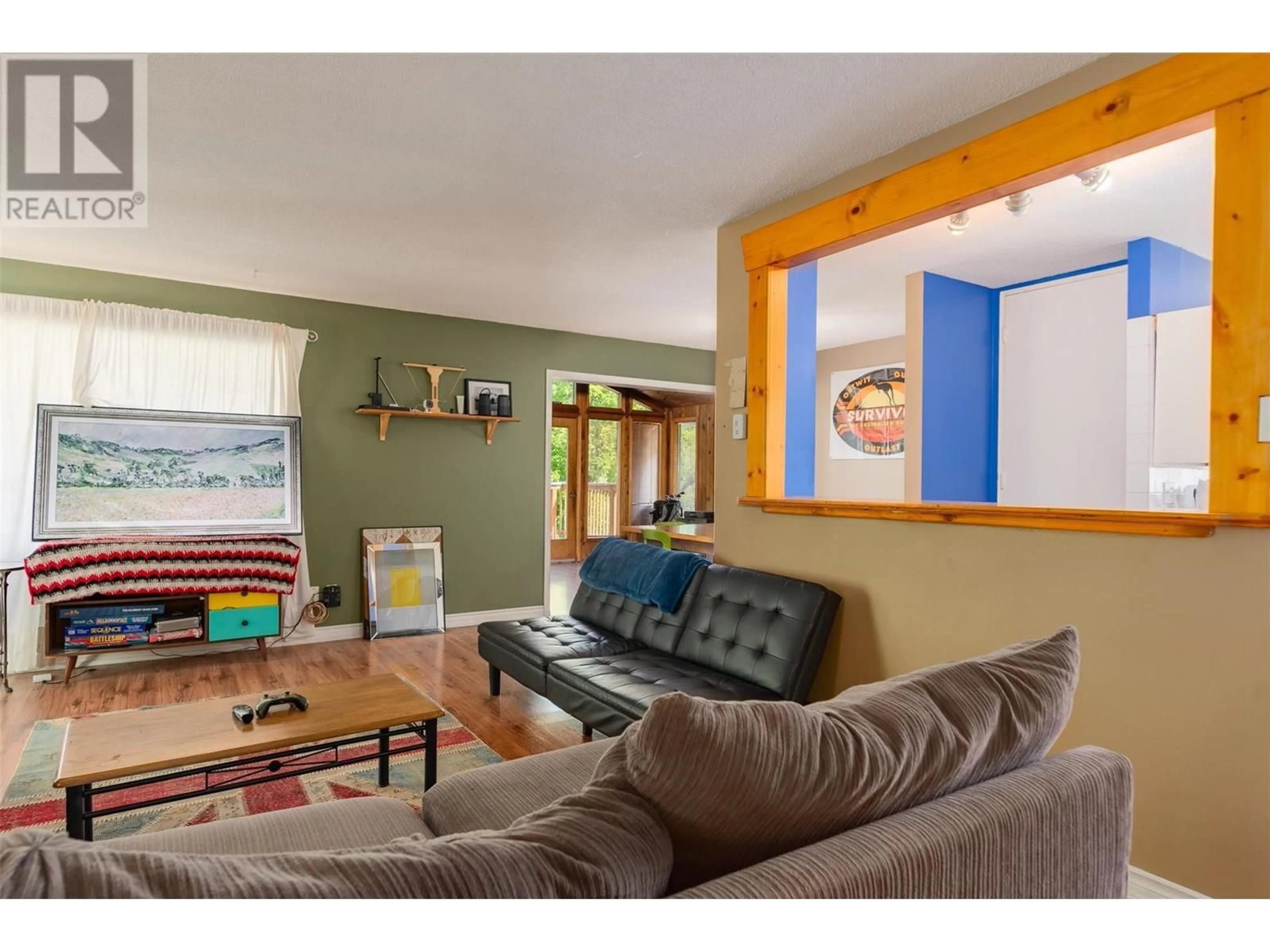 Living room with furniture, wood/laminate floor for 717 INNES STREET, Nelson British Columbia V1L5G5