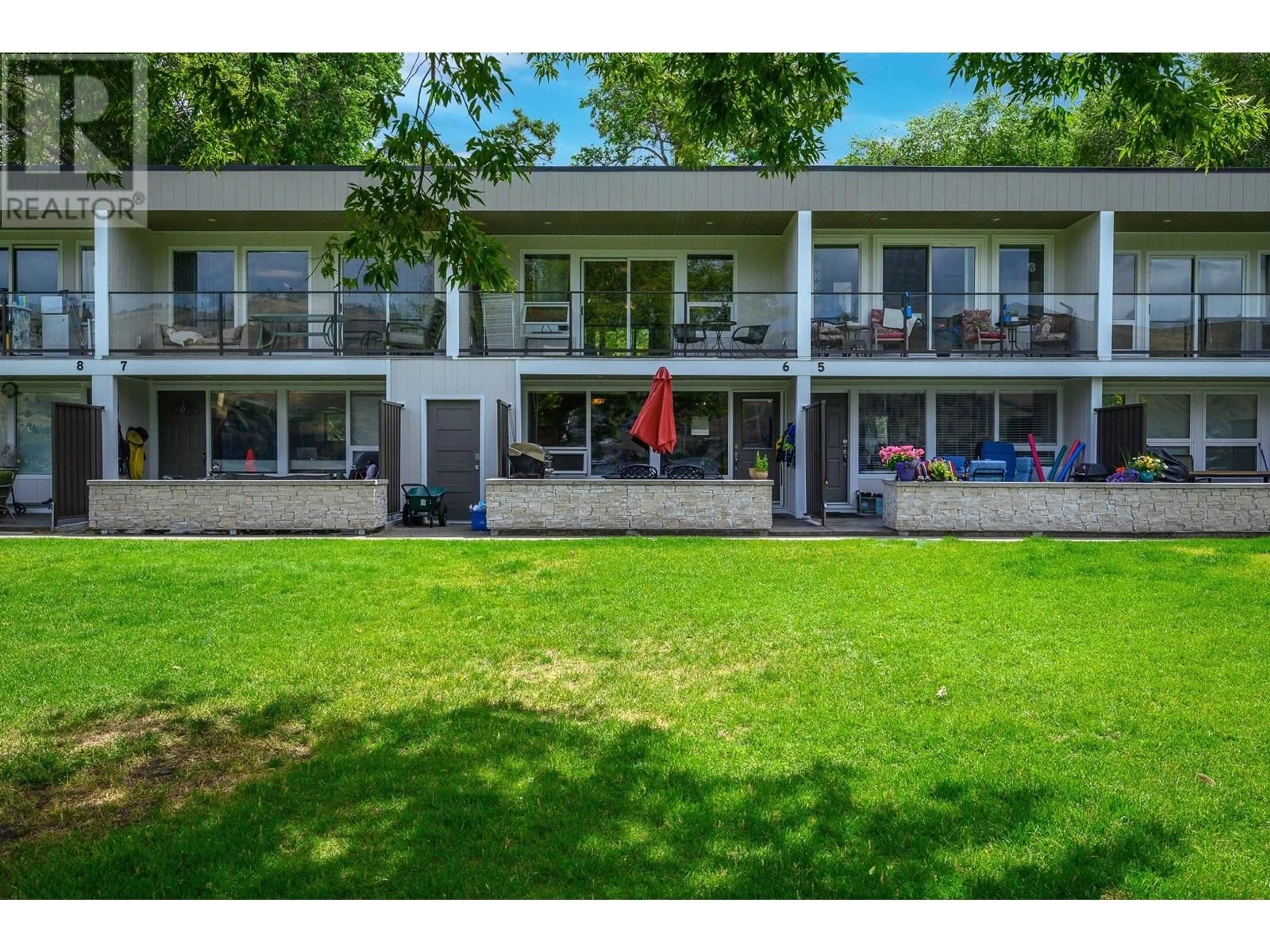 A pic from outside/outdoor area/front of a property/back of a property/a pic from drone, unknown for 6 - 7779 OKANAGAN LANDING ROAD, Vernon British Columbia V1H1L4