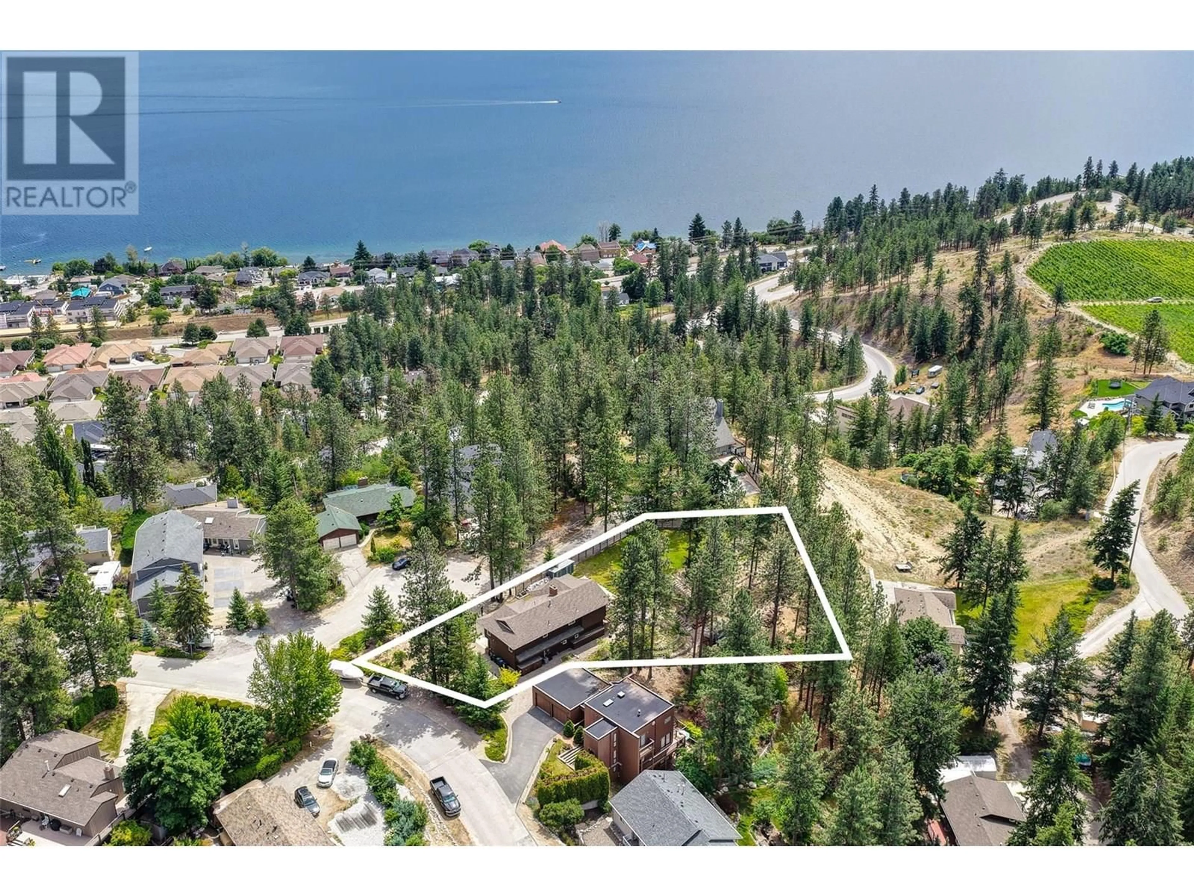 A pic from outside/outdoor area/front of a property/back of a property/a pic from drone, water/lake/river/ocean view for 3947 TREPANIER HEIGHTS PLACE, Peachland British Columbia V0H1X2