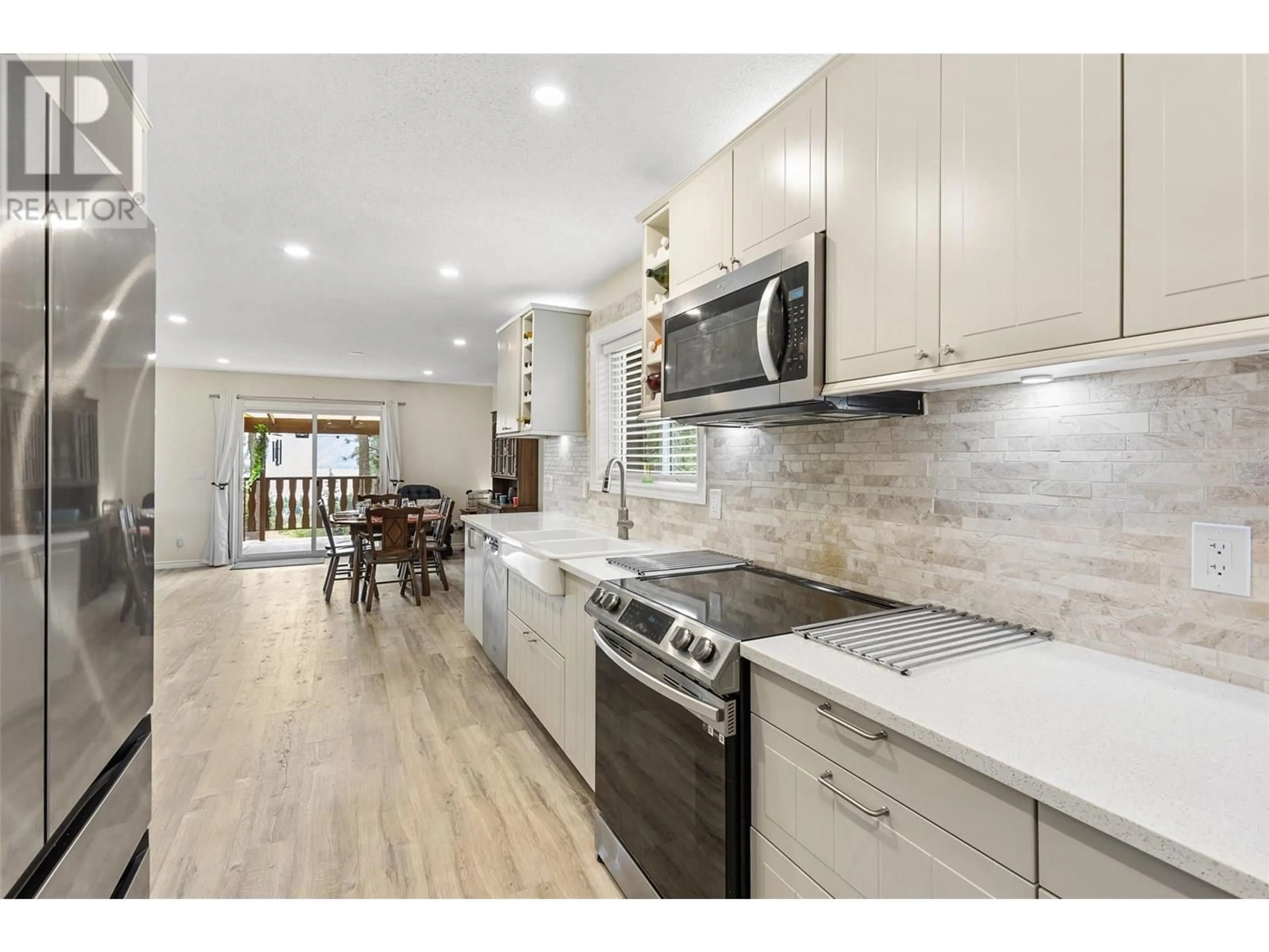 Open concept kitchen, ceramic/tile floor for 3947 TREPANIER HEIGHTS PLACE, Peachland British Columbia V0H1X2