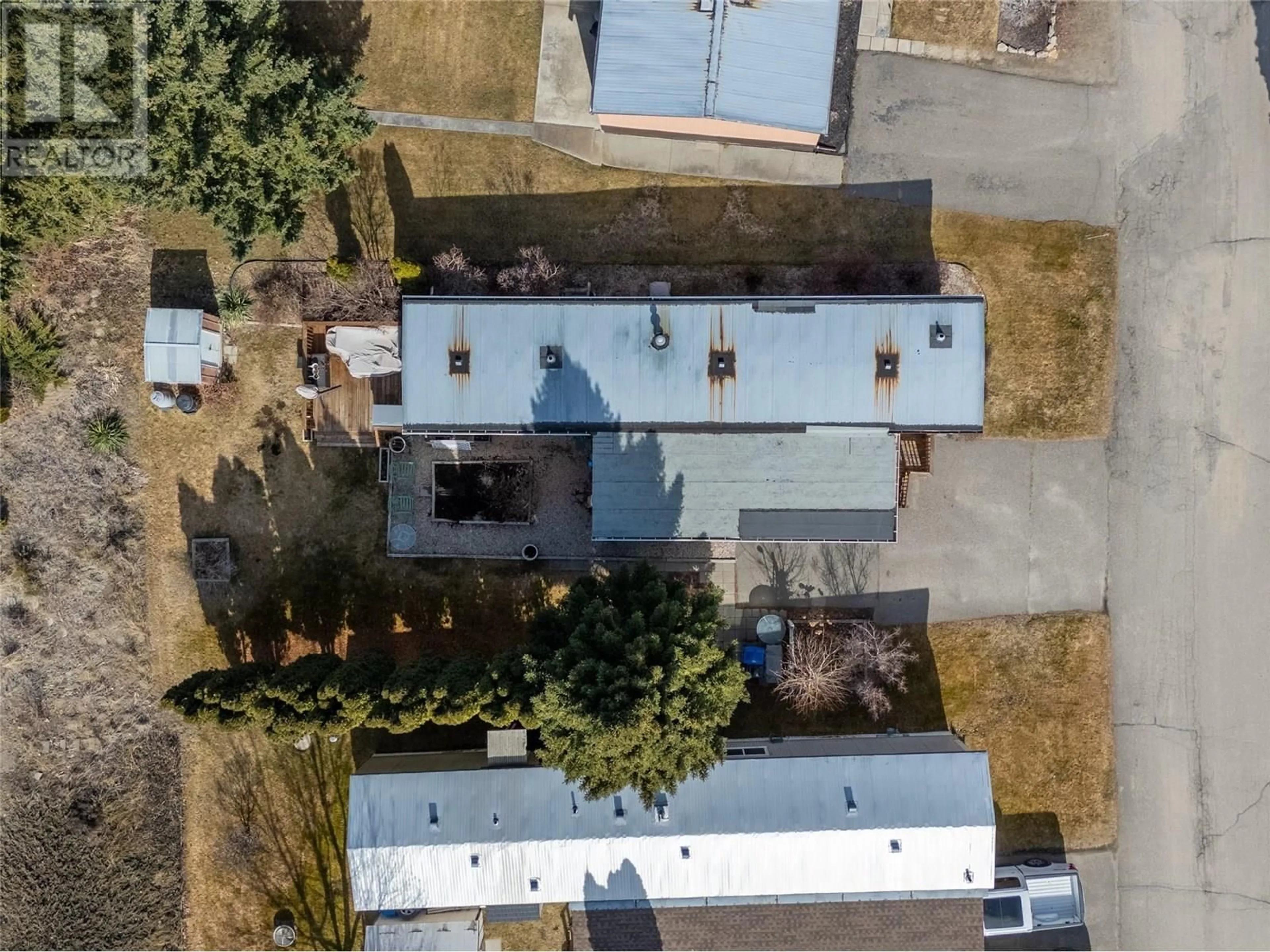 A pic from outside/outdoor area/front of a property/back of a property/a pic from drone, street for 64 - 1929 97 HIGHWAY SOUTH, West Kelowna British Columbia V1Z2Z1