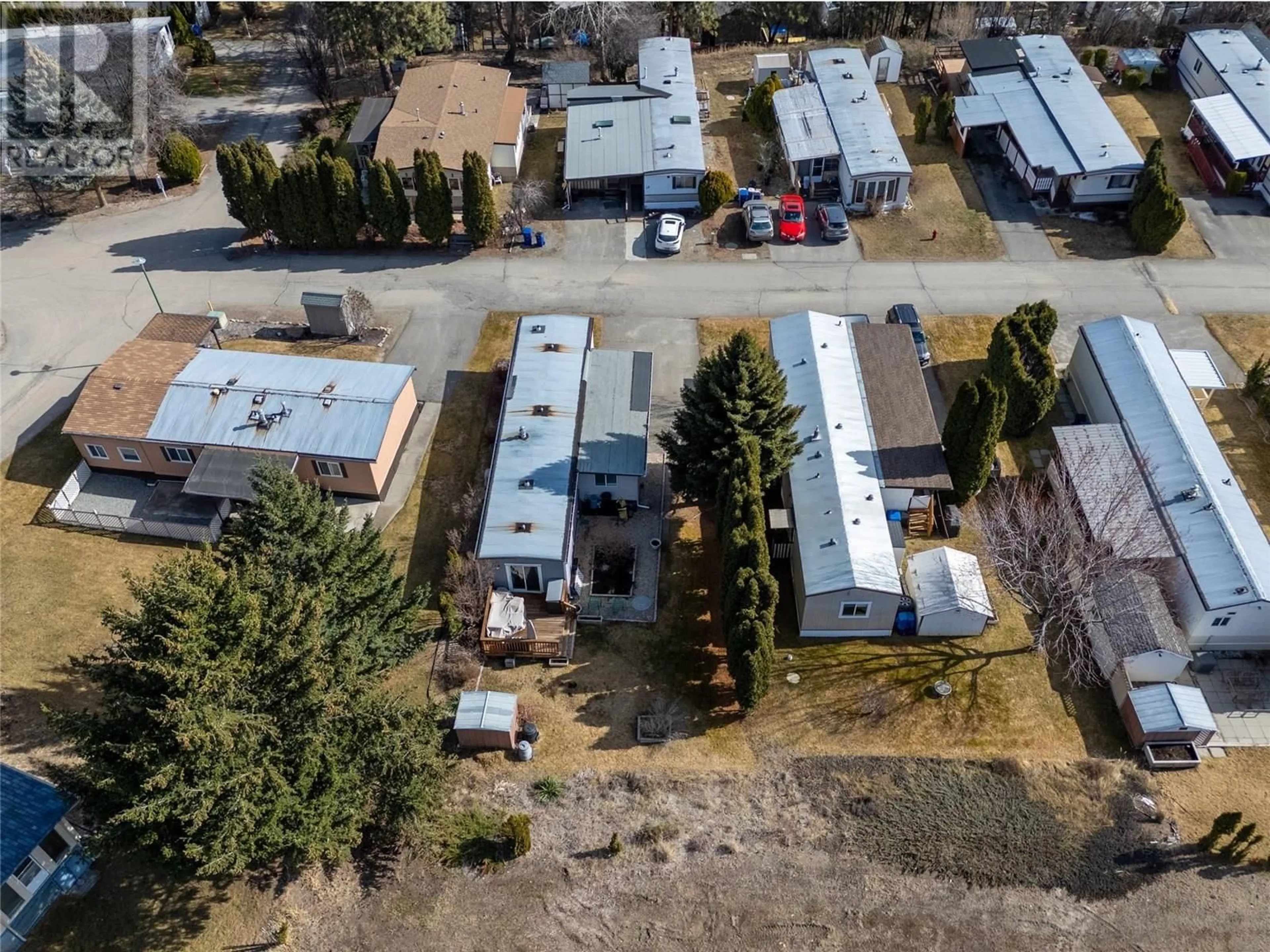 A pic from outside/outdoor area/front of a property/back of a property/a pic from drone, street for 64 - 1929 97 HIGHWAY SOUTH, West Kelowna British Columbia V1Z2Z1