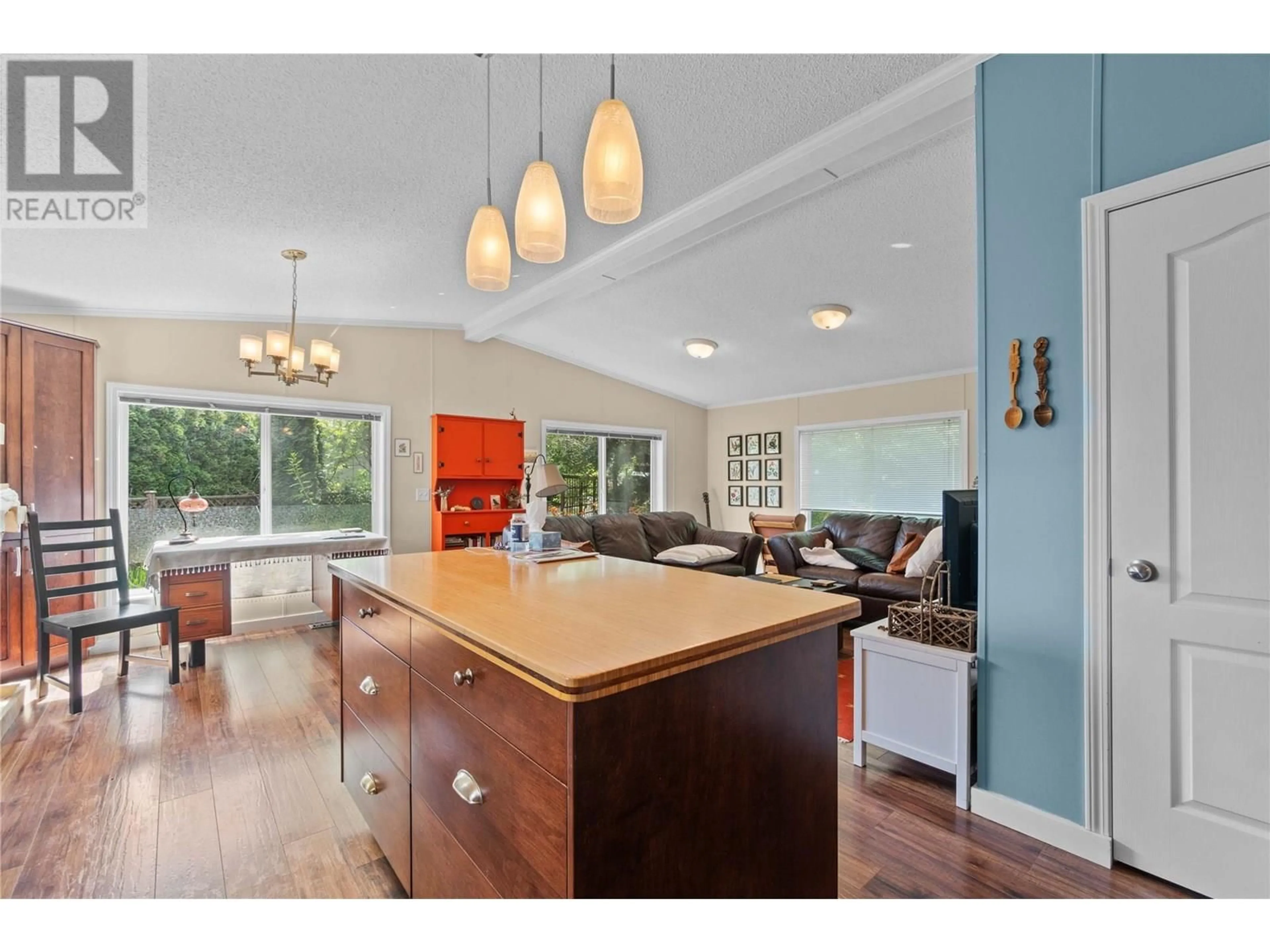 Open concept kitchen, wood/laminate floor for 4421 73 AVENUE NORTHEAST, Salmon Arm British Columbia V0E1K0