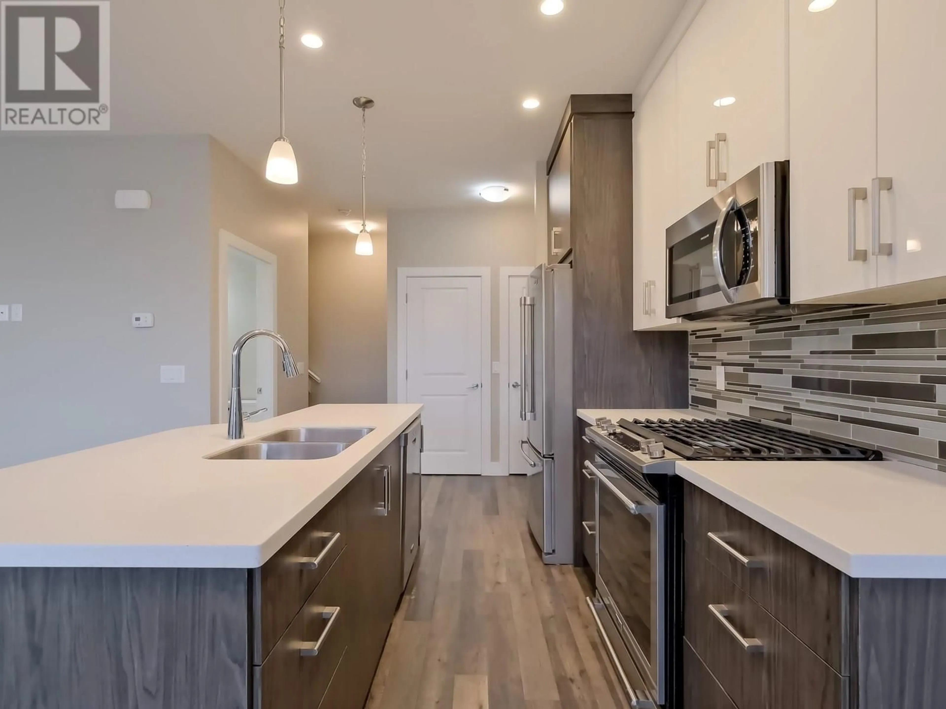 Open concept kitchen, unknown for 102 - 704 REVELSTOKE AVENUE, Penticton British Columbia V2A2J2