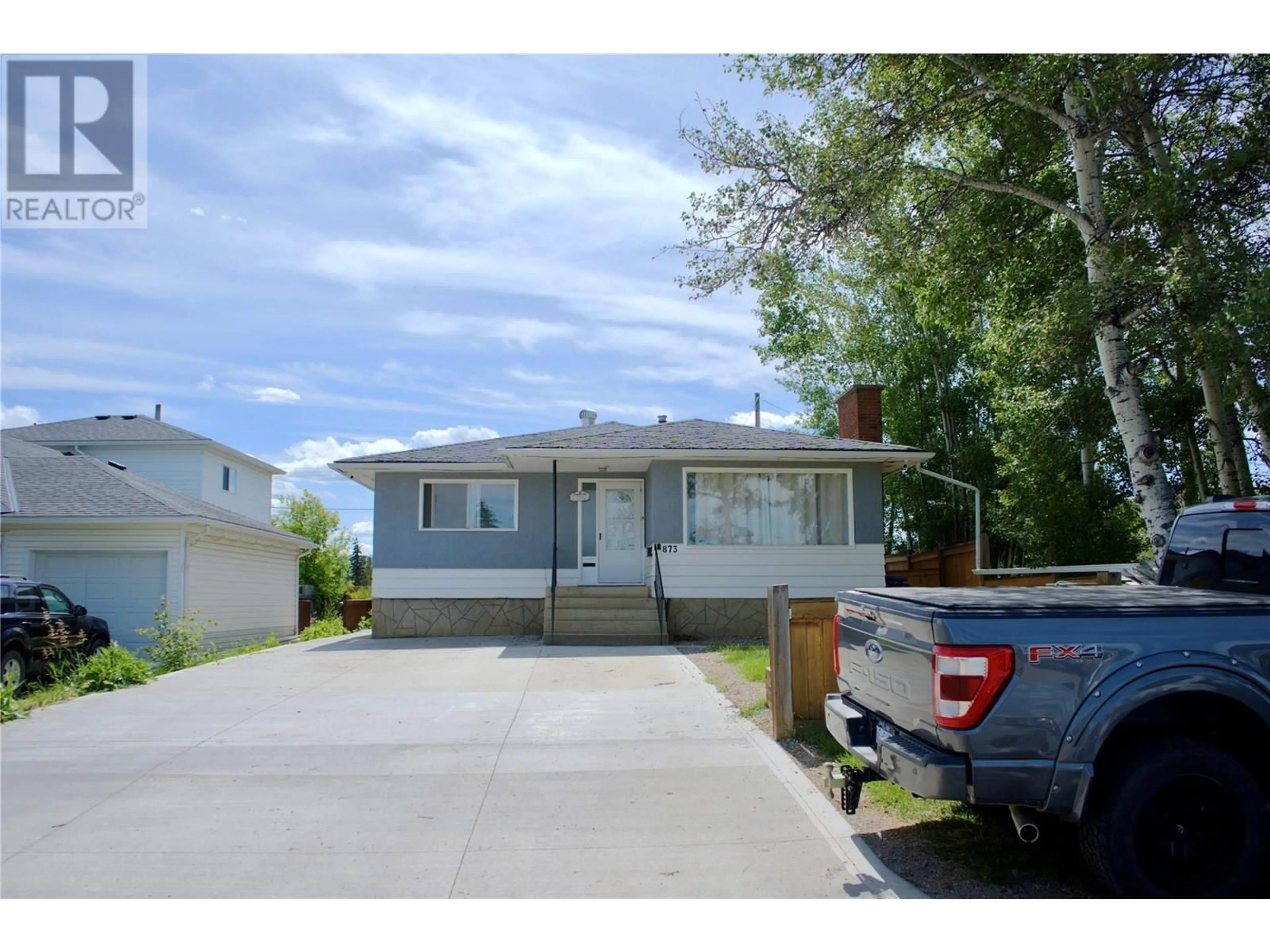 Home with vinyl exterior material, street for 873 107 AVENUE, Dawson Creek British Columbia V1G2R3