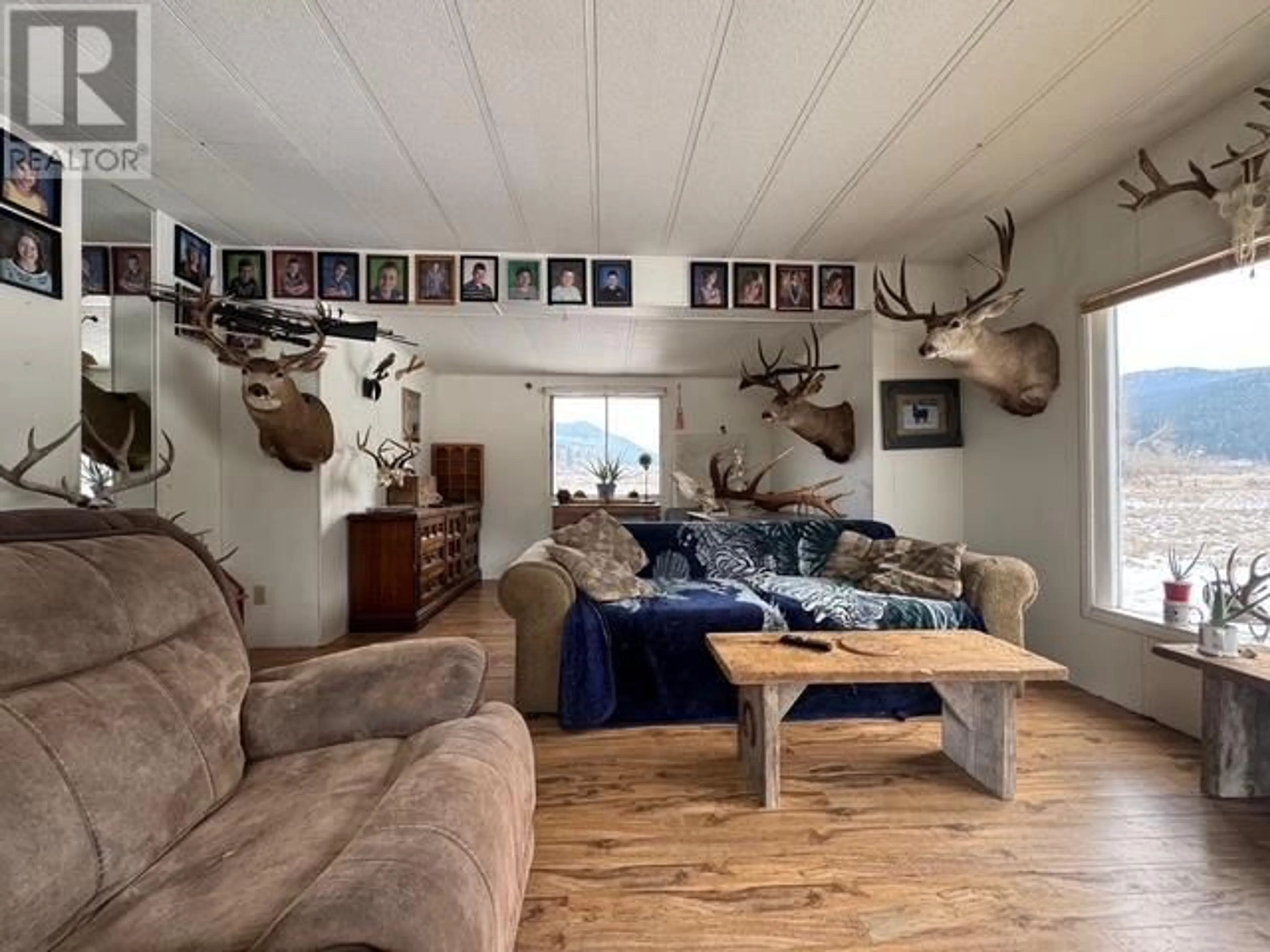 Living room with furniture, wood/laminate floor for 1789 NICOLLS ROAD, Merritt British Columbia V1K1N7