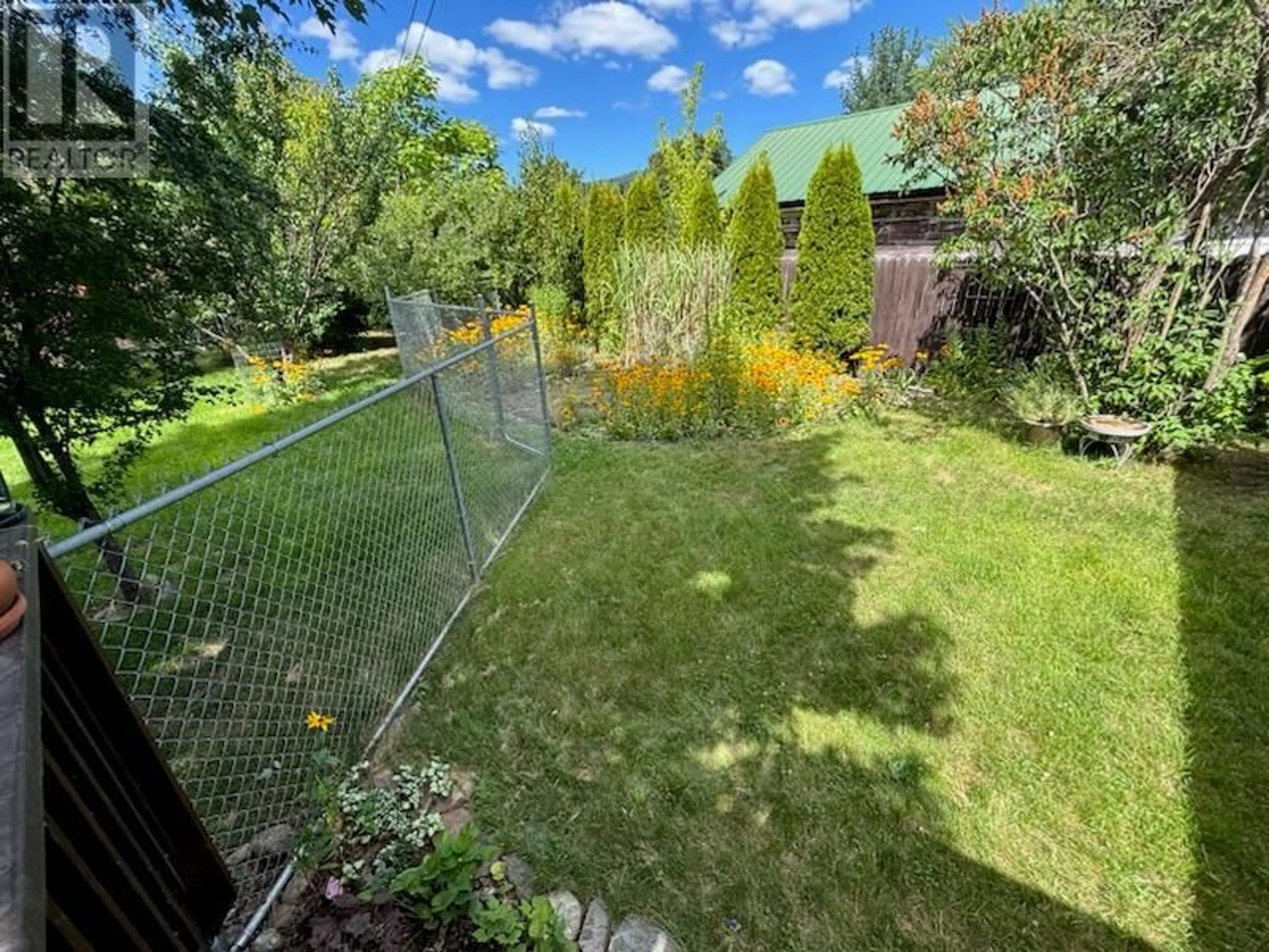 A pic from outside/outdoor area/front of a property/back of a property/a pic from drone, unknown for 7319 9TH STREET, Grand Forks British Columbia V0H1H0