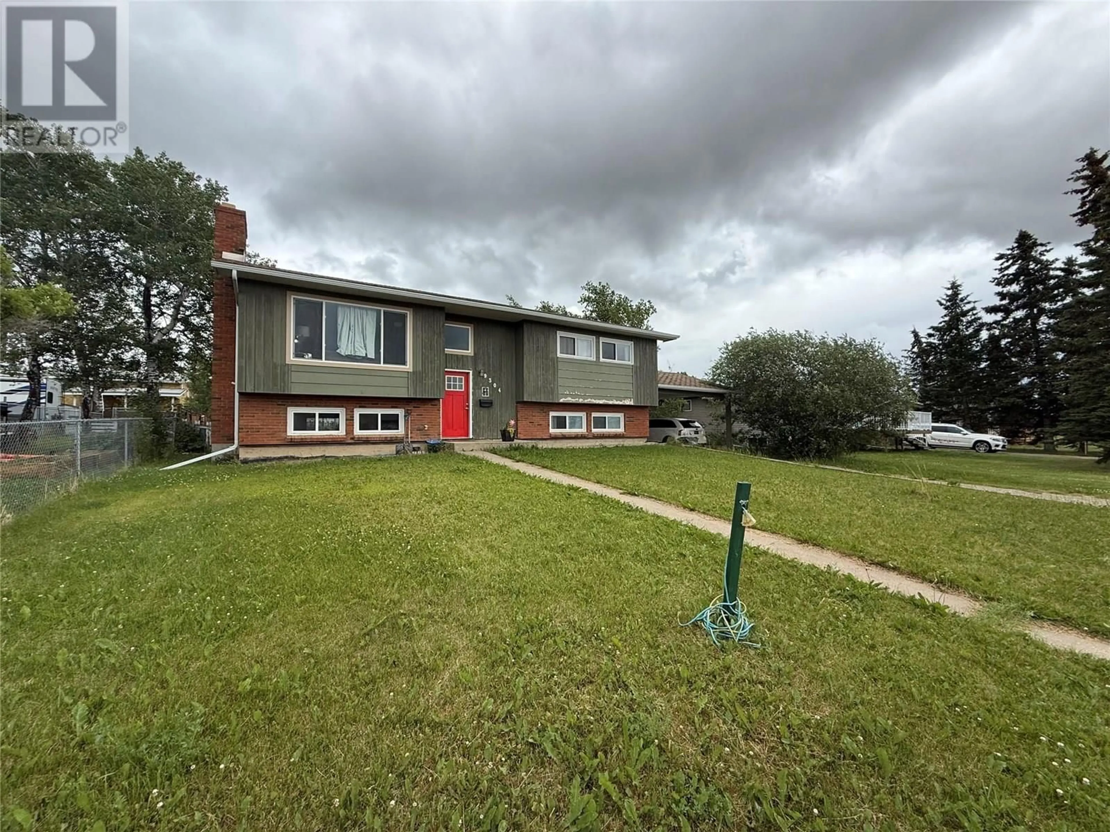 A pic from outside/outdoor area/front of a property/back of a property/a pic from drone, street for 9304 9 STREET, Dawson Creek British Columbia V1G3S3